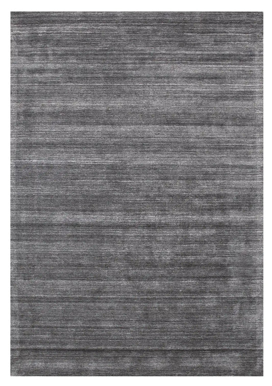 Shadow Fossil is a hand-tufted rug from a blend of wool and silky viscose with a smooth pile and a 12-14mm pile height. Colour Silver with light grey and black accents. Sizes 160 X 230, 200 X 290 and 240 X 340. Full.
