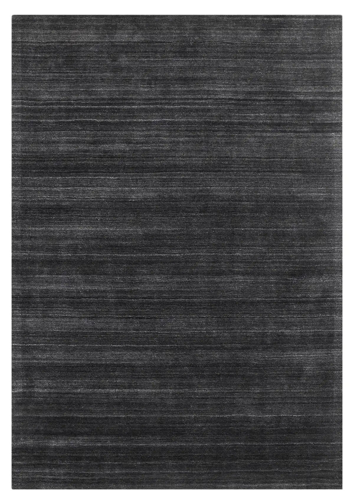 Shadow Smoke is a hand-tufted rug from a blend of wool and silky viscose with a smooth pile and a 12-14mm pile height. Colour black with light grey and silver accents. Sizes 160 X 230, 200 X 290 and 240 X 340. Full.