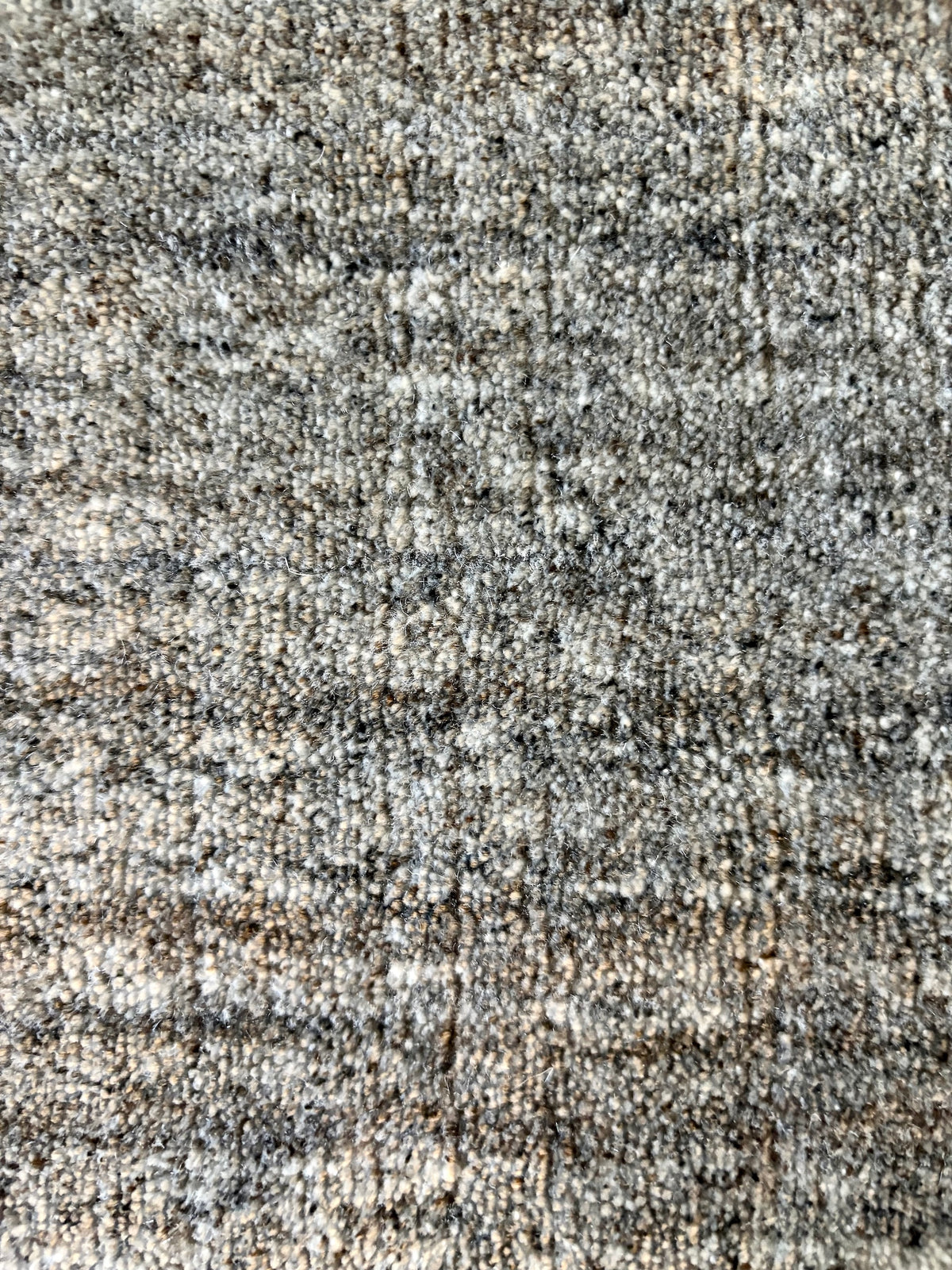 Shadow Fossil is a hand-tufted rug from a blend of wool and silky viscose with a smooth pile and a 12-14mm pile height. Colour Silver with light grey and black accents. Sizes 160 X 230, 200 X 290 and 240 X 340. Close.