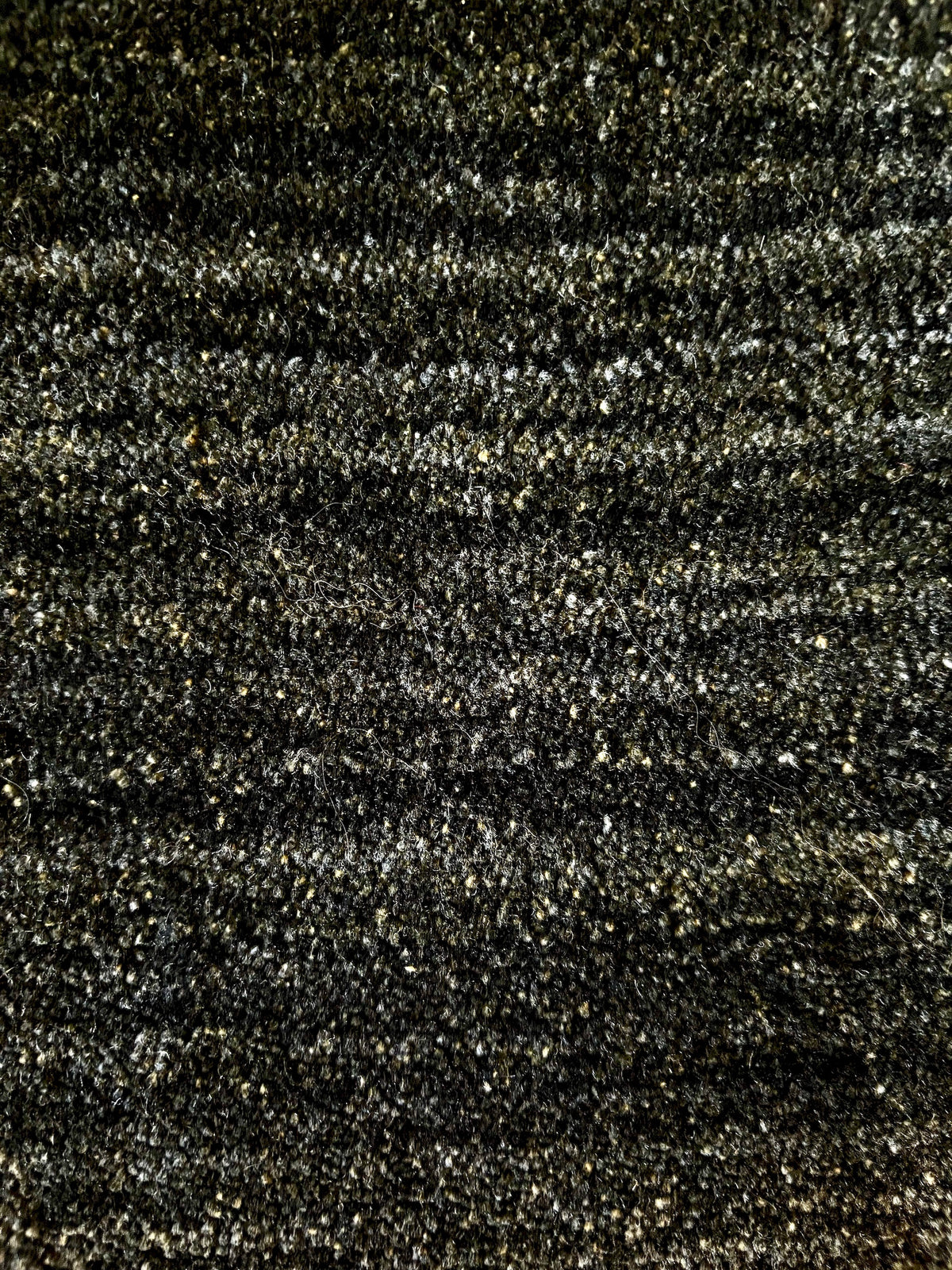 Shadow Sea Green is a hand-tufted rug from a blend of wool and silky viscose with a smooth pile and a 12-14mm pile height. Colour Dark green with grey and black accents. Sizes 160 X 230, 200 X 290 and 240 X 340. Close.