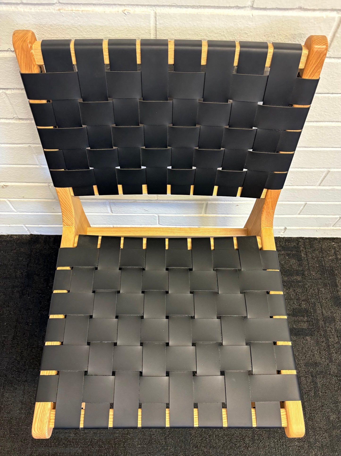 The Shawnee - Black Dining Chair, features an ash frame and black saddle leather. It has a strapped seat and back. Colours, natural frame with black leather. Measures 510 wide X 550 depth X 460 Seat height. Back height 840. Top.