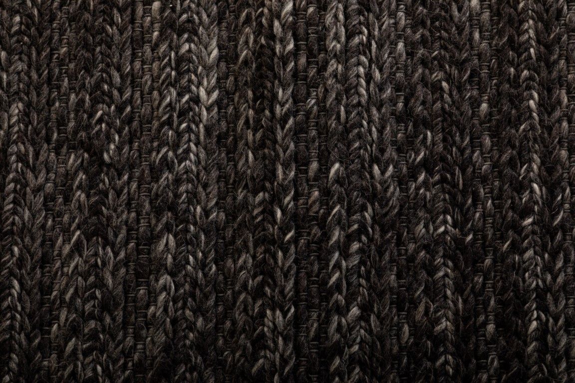 Svend Charcoal is a contemporary hand woven braided pile wool rug.  Colour Charcoal/black. Sizes 155 X 225, 200 X 290, 240 X 320 and 300 X 400. Close.