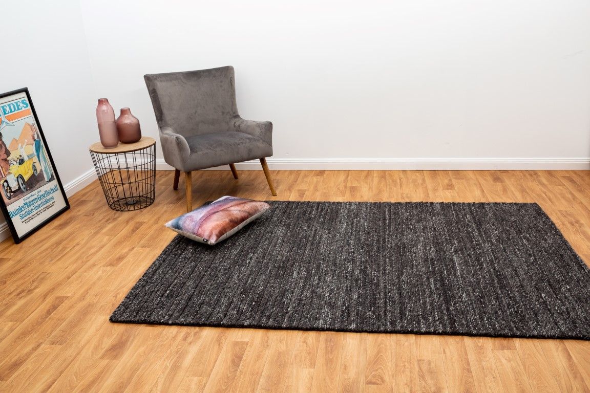 Svend Charcoal is a contemporary hand woven braided pile wool rug.  Colour Charcoal/black. Sizes 155 X 225, 200 X 290, 240 X 320 and 300 X 400. Life.