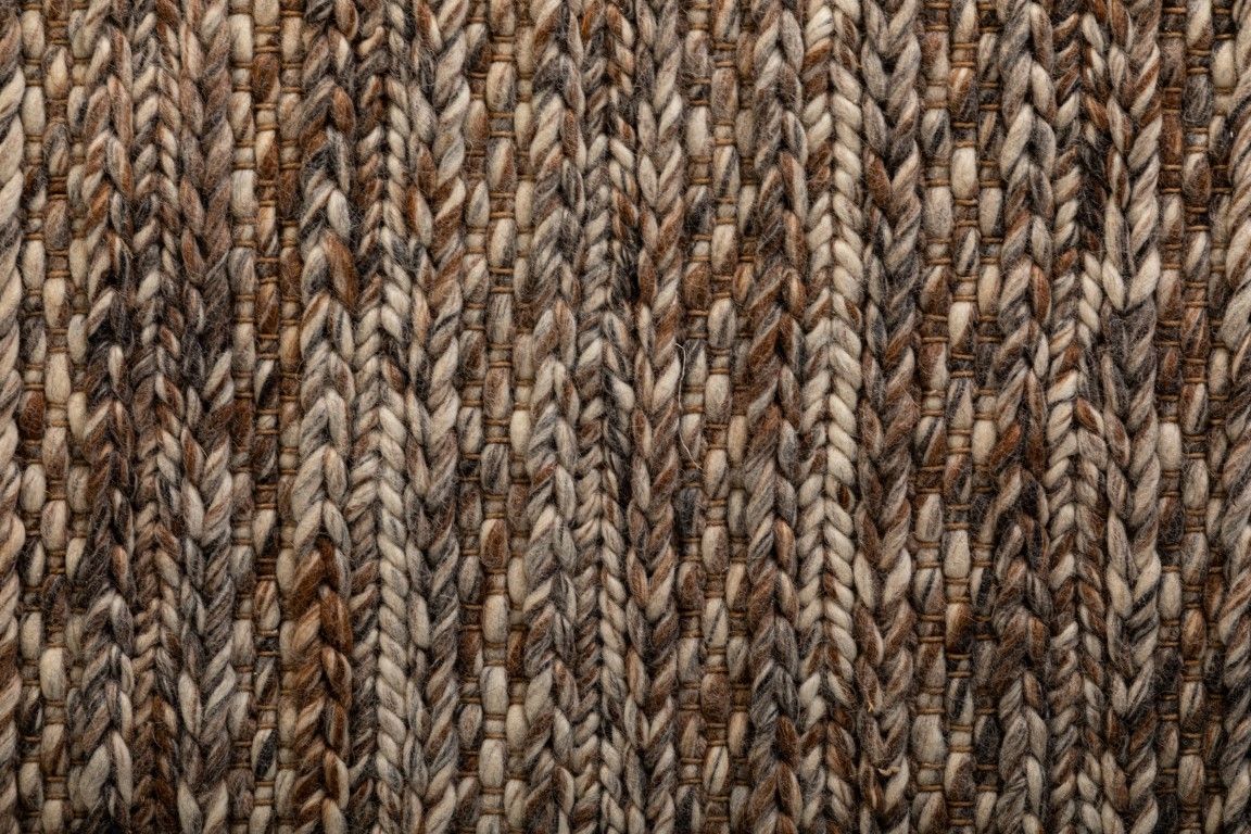 Svend Mocha is a contemporary hand woven braided pile wool rug.  Colour Mocha brown. Sizes 155 X 225, 200 X 290, 240 X 320 and 300 X 400. Close.