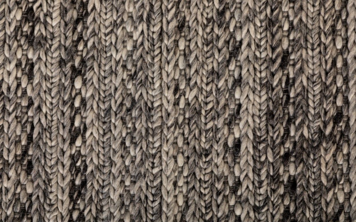 Svend Silver Grey is a contemporary hand woven braided pile wool rug.  Colour Dark Grey, Grey and Light Grey. Sizes 155 X 225, 200 X 290, 240 X 320 and 300 X 400. Close.