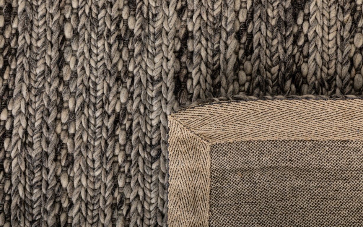 Svend Silver Grey is a contemporary hand woven braided pile wool rug.  Colour Dark Grey, Grey and Light Grey. Sizes 155 X 225, 200 X 290, 240 X 320 and 300 X 400. Fold.