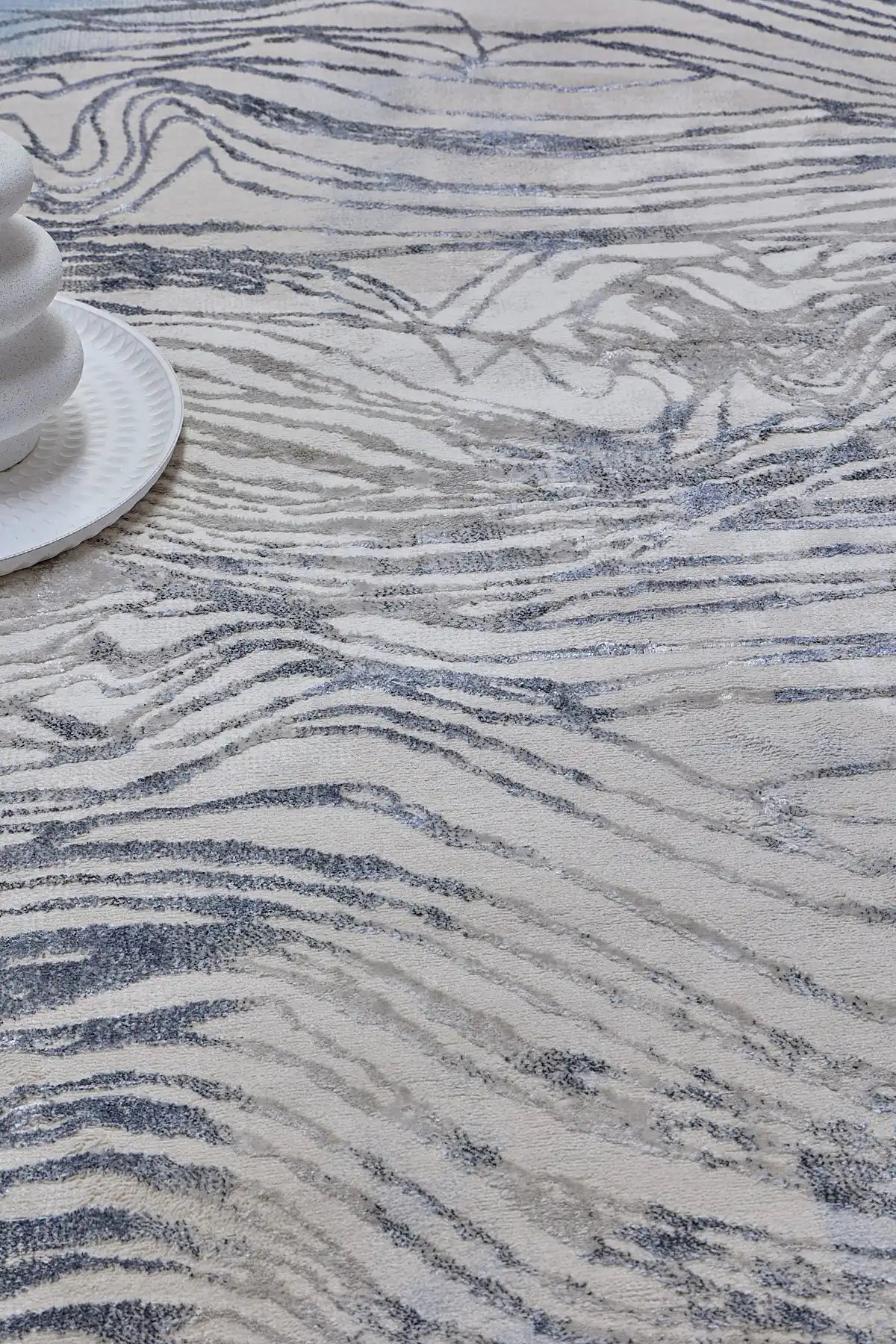 Swiss Blue is a machine-made polyester rug with an abstract modern/contemporary design. It boasts a 7-9mm pile height. Colours white and silver with blue accents. Sizes 160 X 230, 200 X 290, 240 X 340 and 300 X 400. Life.