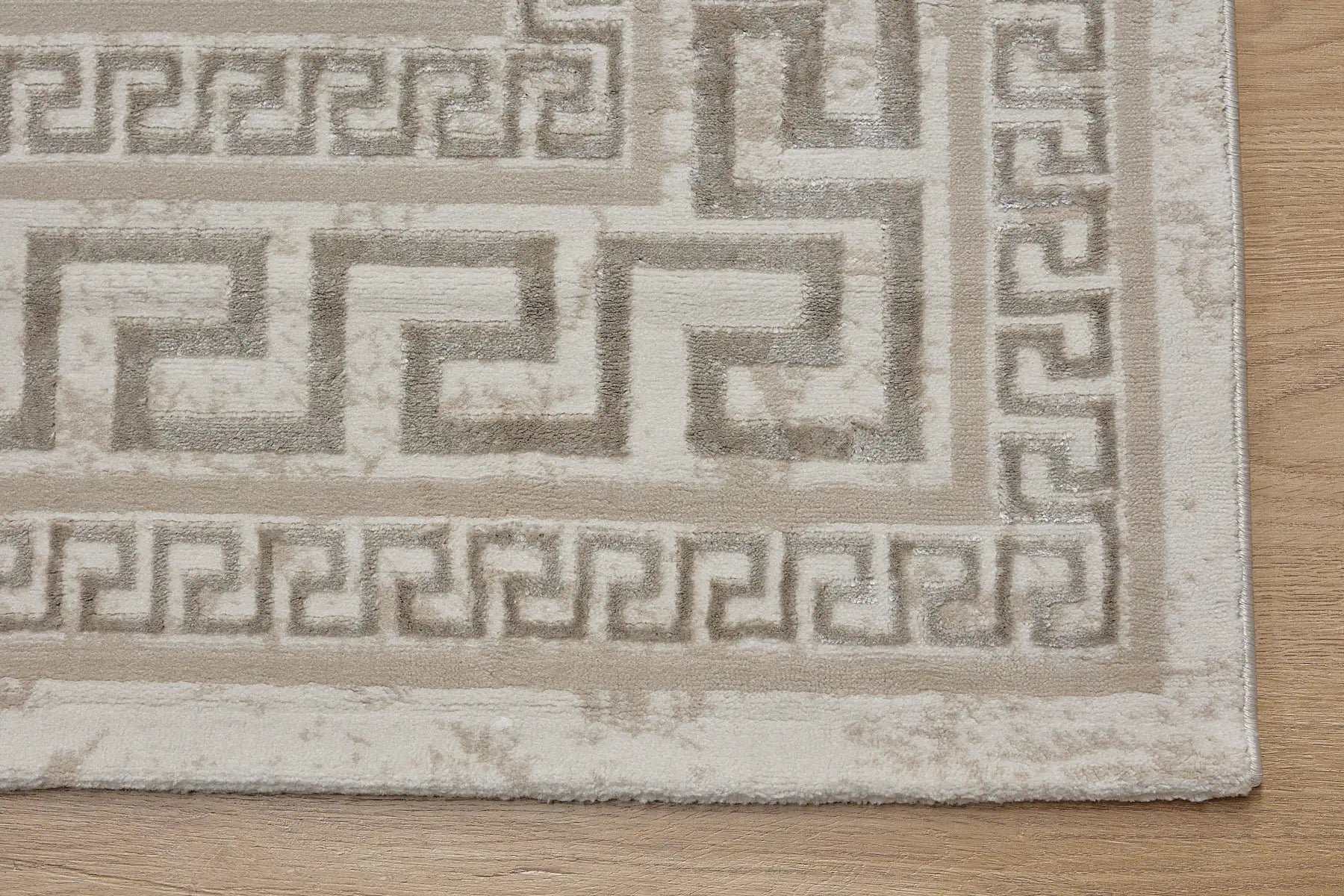 Swiss Border is a machine-made polyester rug with an abstract modern/contemporary design. It boasts a 7-9mm pile height. Colours light grey and silver accents. Sizes 160 X 230, 200 X 290, 240 X 340 and 300 X 400. Corner.