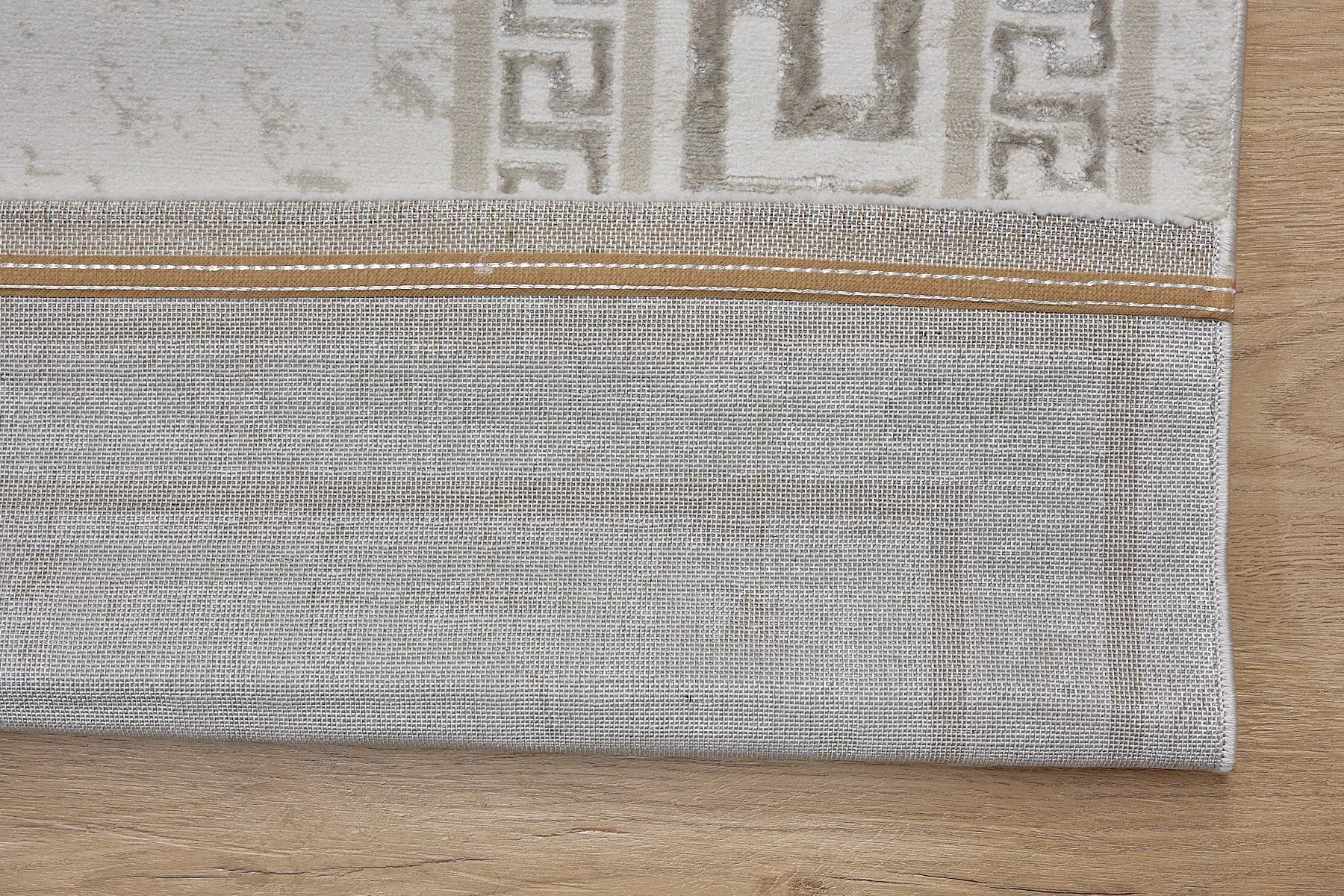 Swiss Border is a machine-made polyester rug with an abstract modern/contemporary design. It boasts a 7-9mm pile height. Colours light grey and silver accents. Sizes 160 X 230, 200 X 290, 240 X 340 and 300 X 400. Fold.