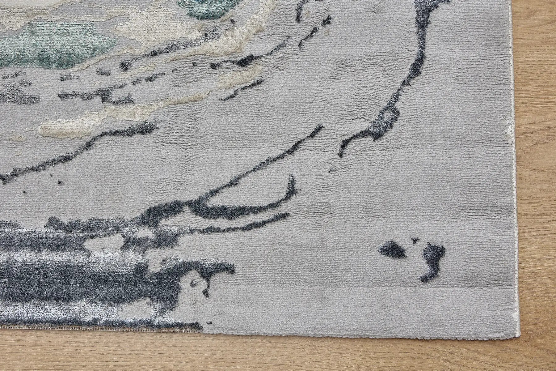 Swiss Thumb is a machine-made polyester rug with an abstract modern/contemporary design. It boasts a 7-9mm pile height. Colours silver, white, blue and beige accents. Sizes 160 X 230, 200 X 290, 240 X 340 and 300 X 400. Corner.