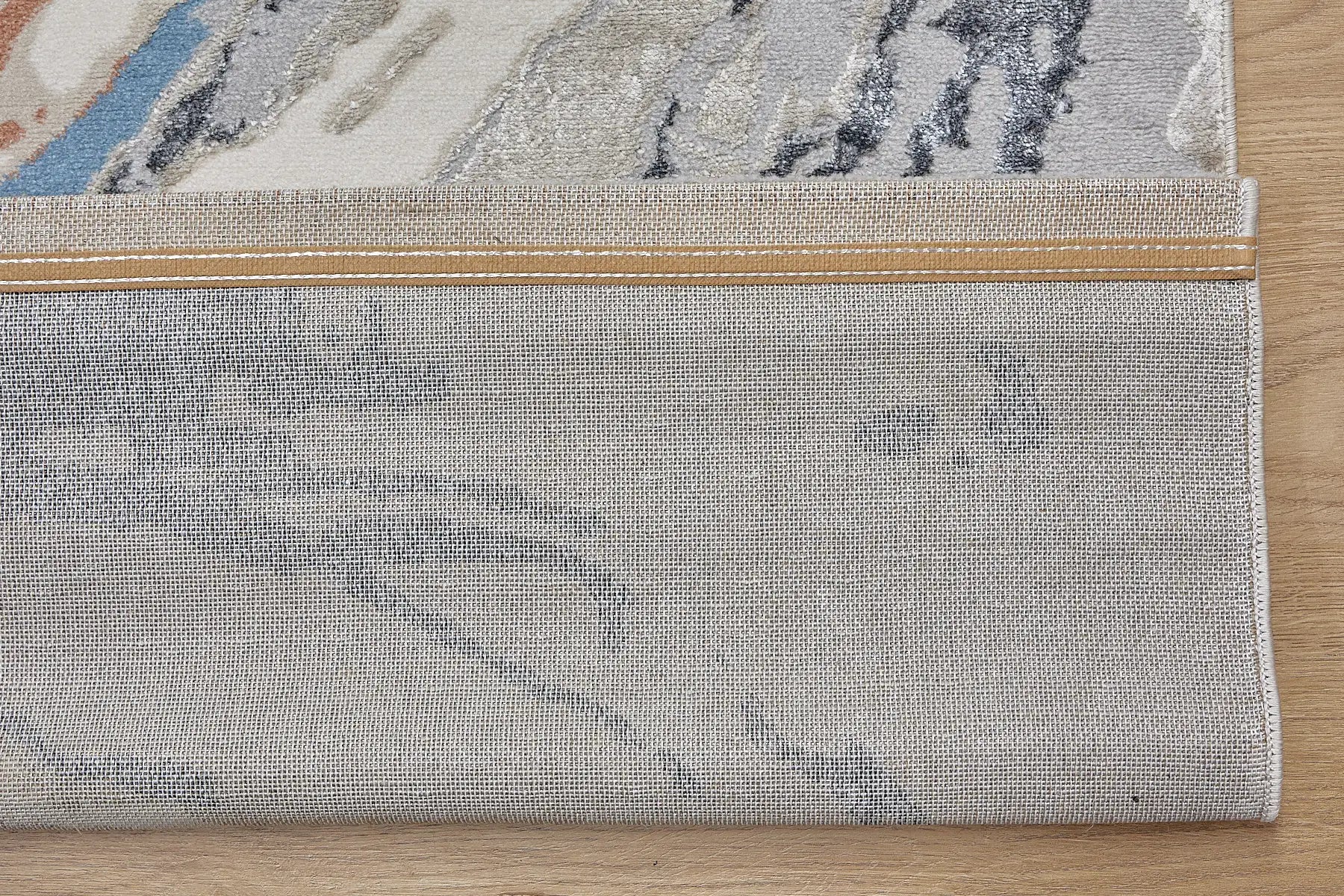 Swiss Thumb is a machine-made polyester rug with an abstract modern/contemporary design. It boasts a 7-9mm pile height. Colours silver, white, blue and beige accents. Sizes 160 X 230, 200 X 290, 240 X 340 and 300 X 400. Fold.