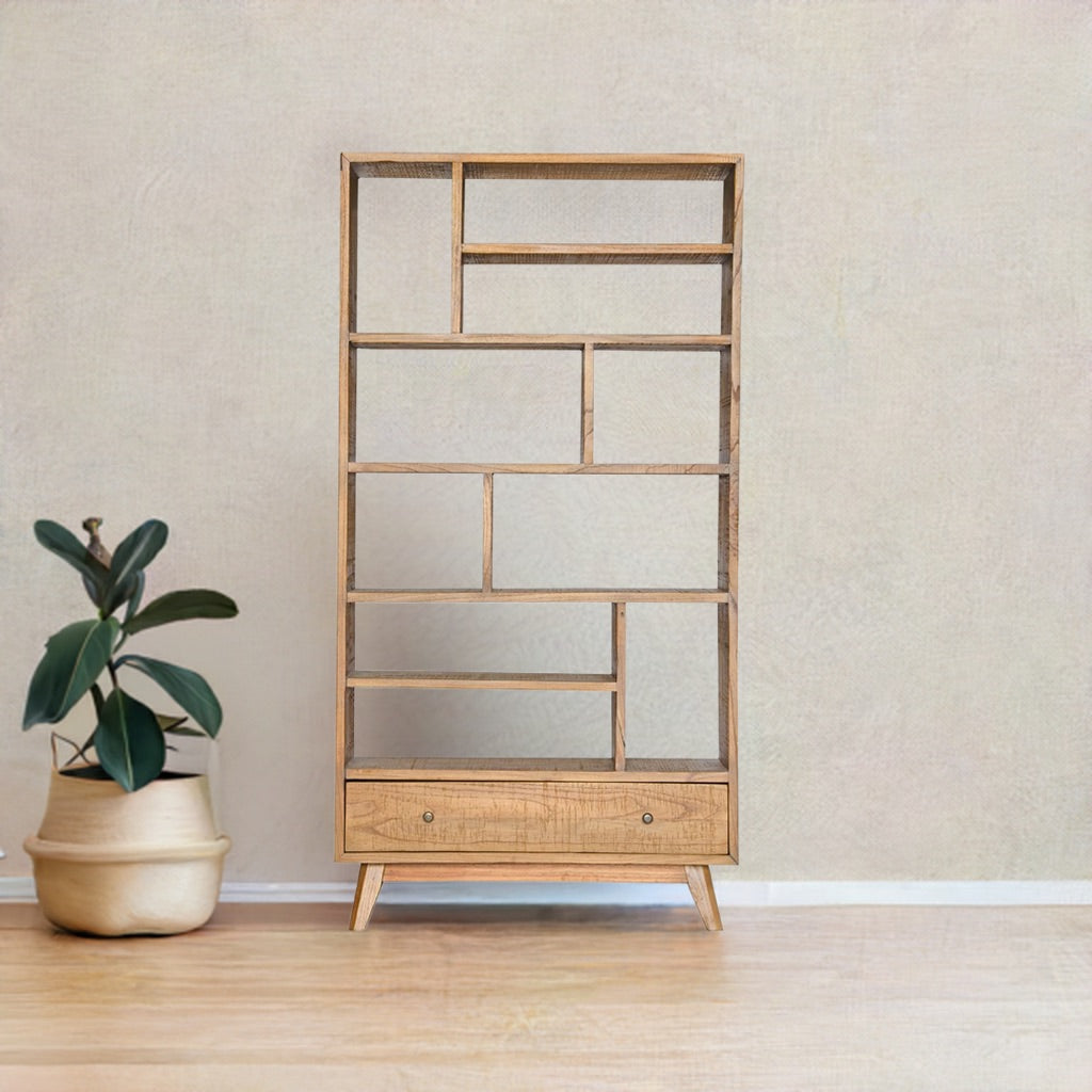 The Taurus 1 Drawer Bookshelf. Multi pigeon holes with 1 drawer at the bottom. Constructed from teak. Measures 1900 Height x 350 Depth x 1000 Wide. Colour natural. Styled.