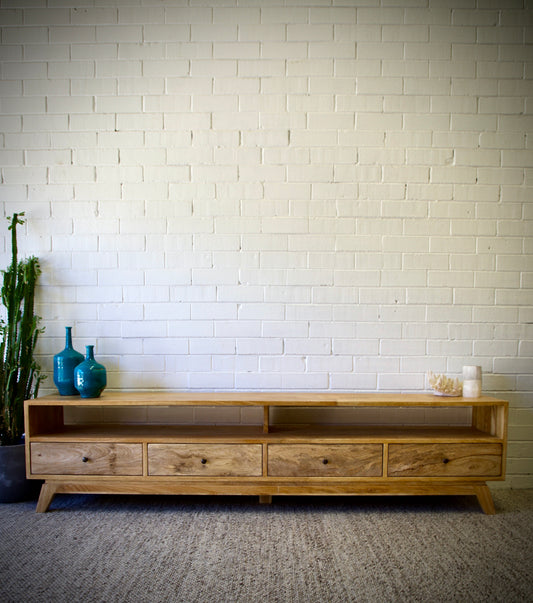 The Taylor 2500 Entertainment Unit features a modern style. It is constructed of sustainable fruitwood. The 4 drawers are on wooden runners and has two open shelves. Colour natural. Measures 2500 length X 400 depth X 500 height. Front Styled.