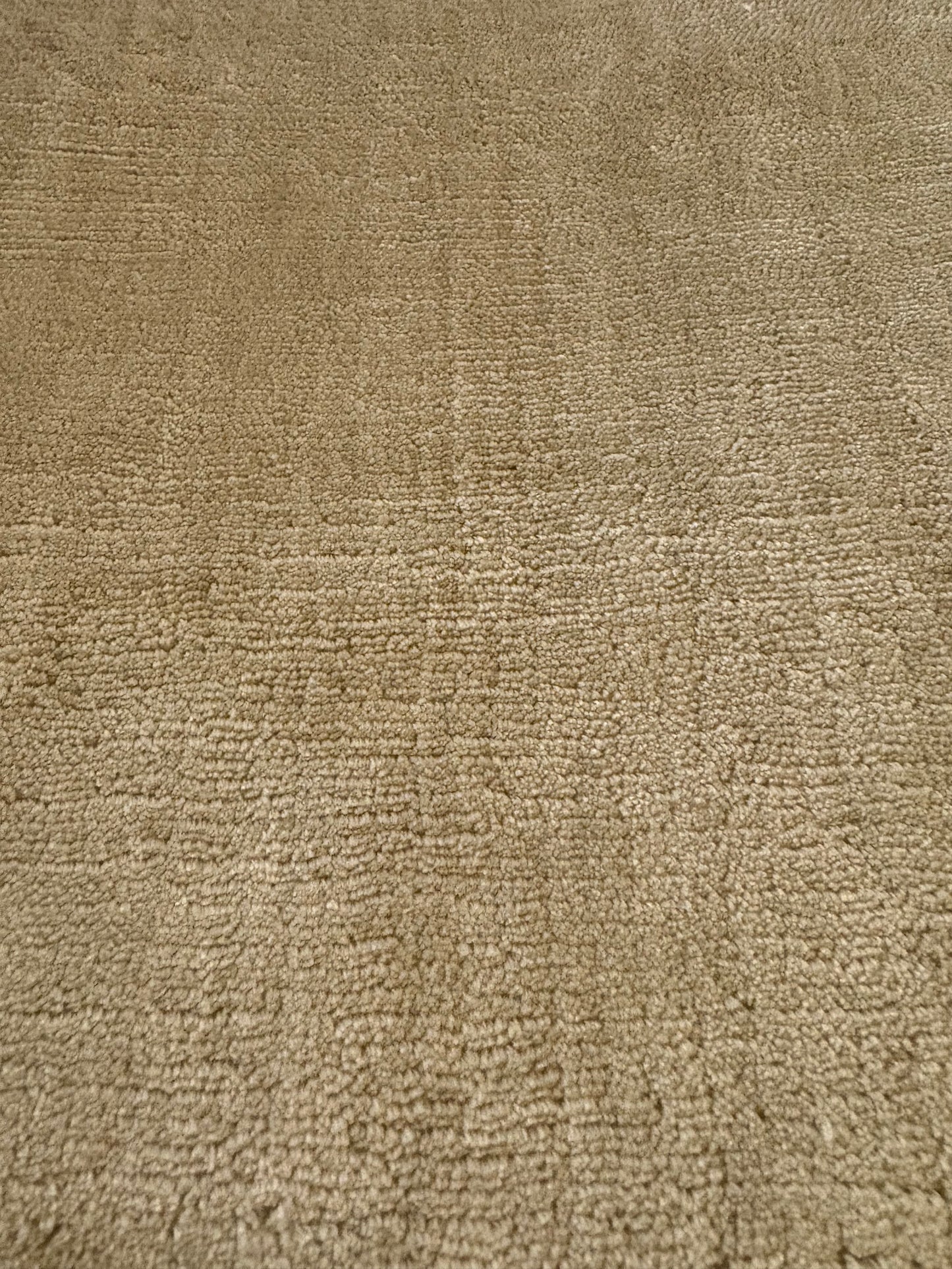 Tempo Beige is a hand-loomed low- cut piled rug. Crafted with bamboo silk, it offers medium texture and has a pile height of 10-12mm. Colour beige. Sizes 160 X 230, 200 X 290 and 240 X 340. Non-Sheen Side.