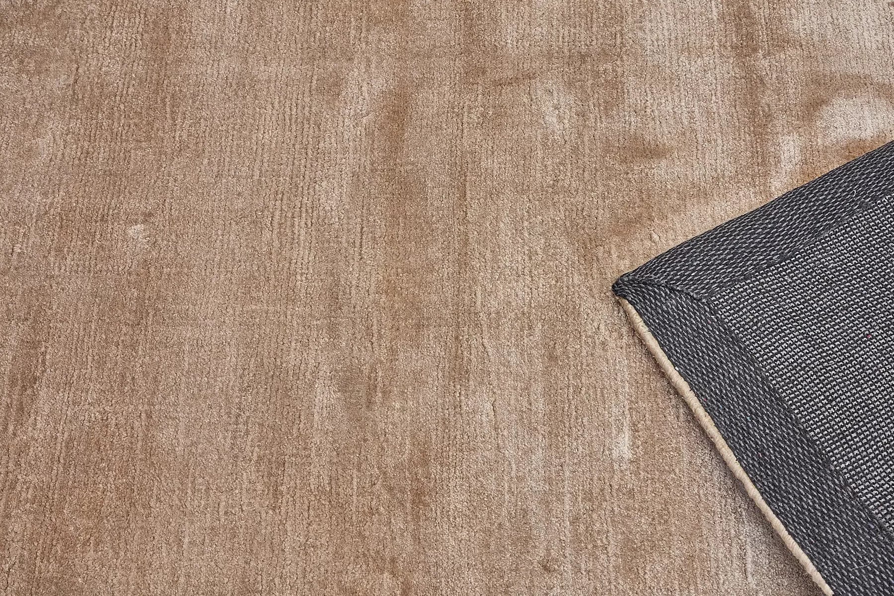 Tempo Brown is a hand-loomed and hand tufted rug. Crafted with bamboo silk, it offers medium texture and has a pile height of 10-12mm. Colour light brown. Sizes 160 X 230, 200 X 290 and 240 X 340. Fold.