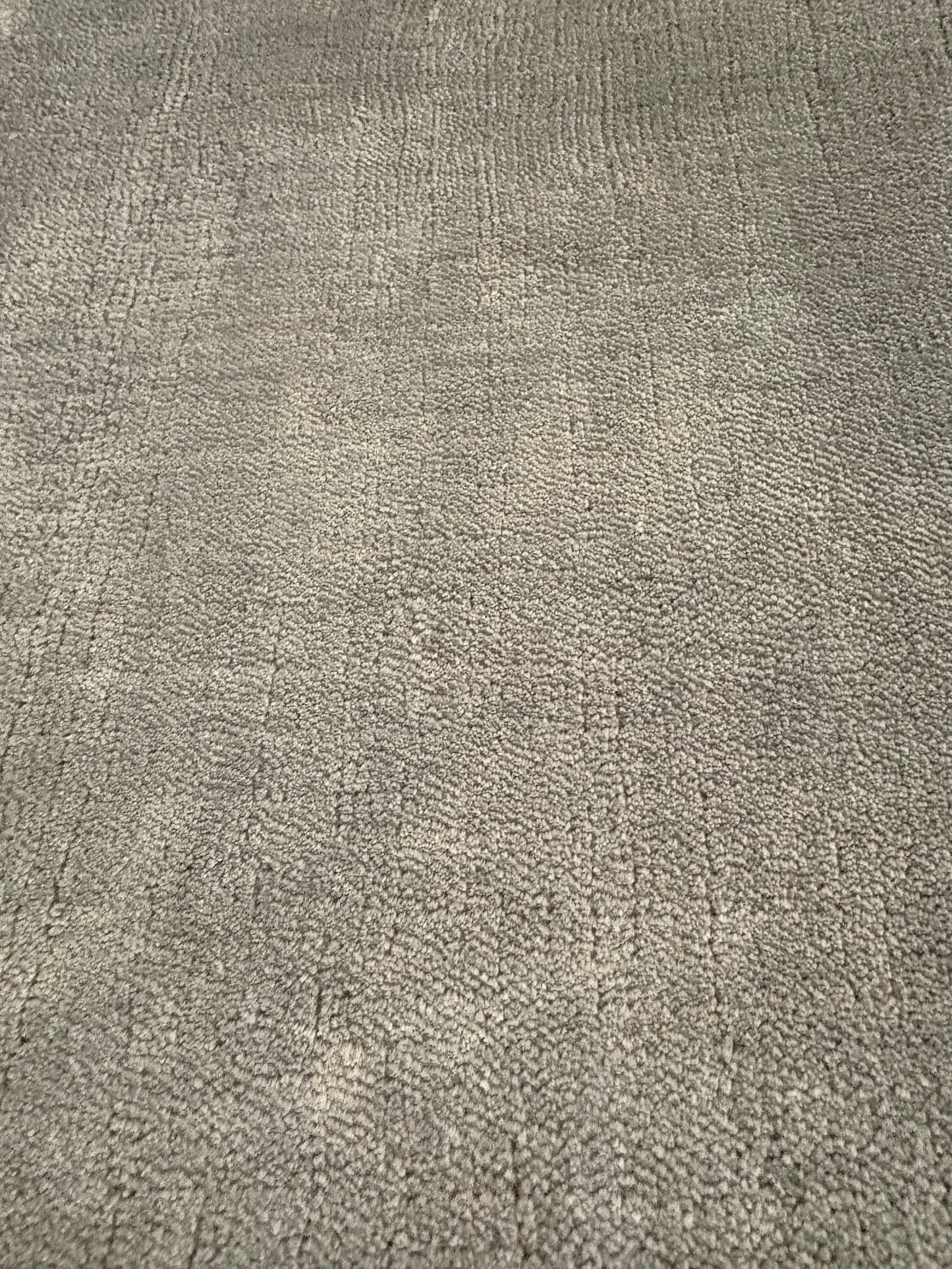 Tempo Grey is a hand-loomed low-cut piled rug. Crafted with bamboo silk, it offers medium texture and has a pile height of 10-12mm. Colour light grey. Sizes 160 X 230, 200 X 290 and 240 X 340.  Non Sheen Side.