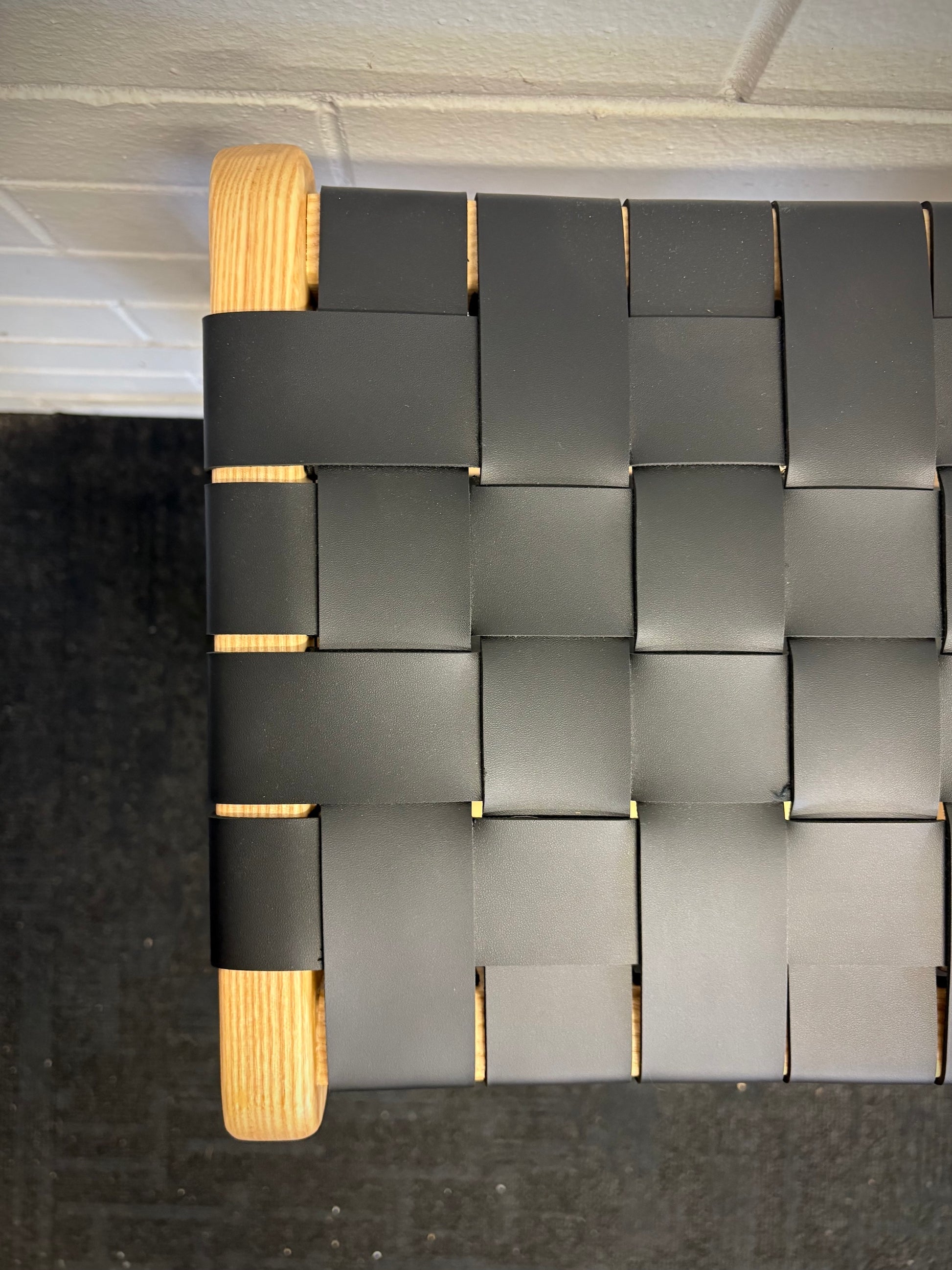 The Thames Barstool, black leather, is designed with a contemporary style. Featuring a sustainable ash frame and a luxurious strapped saddle leather seat. Colour natural frame with black leather. Measures 410 wide X 320 depth X 640 height. Top.