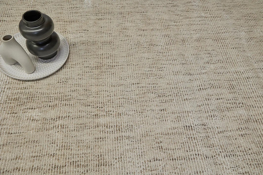 Toro Beige is a hand-loomed, hand-knotted rug with a contemporary multi-fleck design. Wool and silky viscose are blended to create a soft feel with its 10-12mm pile height. Colour light beige with brown accents. Sizes 160 X 230, 200 X 290 and 240 X 340. Life.