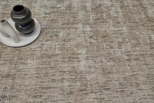 Toro Taupe is a hand-loomed, hand-knotted rug with a contemporary multi-fleck design. Wool and silky viscose are blended to create a soft feel with its 10-12mm pile height. Colour Beige with cream and black accents. Sizes 160 X 230, 200 X 290 and 240 X 340. Life.