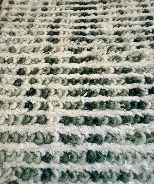 Toro Green is a hand-loomed, hand-knotted rug with a contemporary multi-fleck design. Wool and silky viscose are blended to create a soft feel with its 10-12mm pile height. Colour emerald green with white accents. Sizes 160 X 230, 200 X 290, 240 X 340 and 300 X 400. Close.