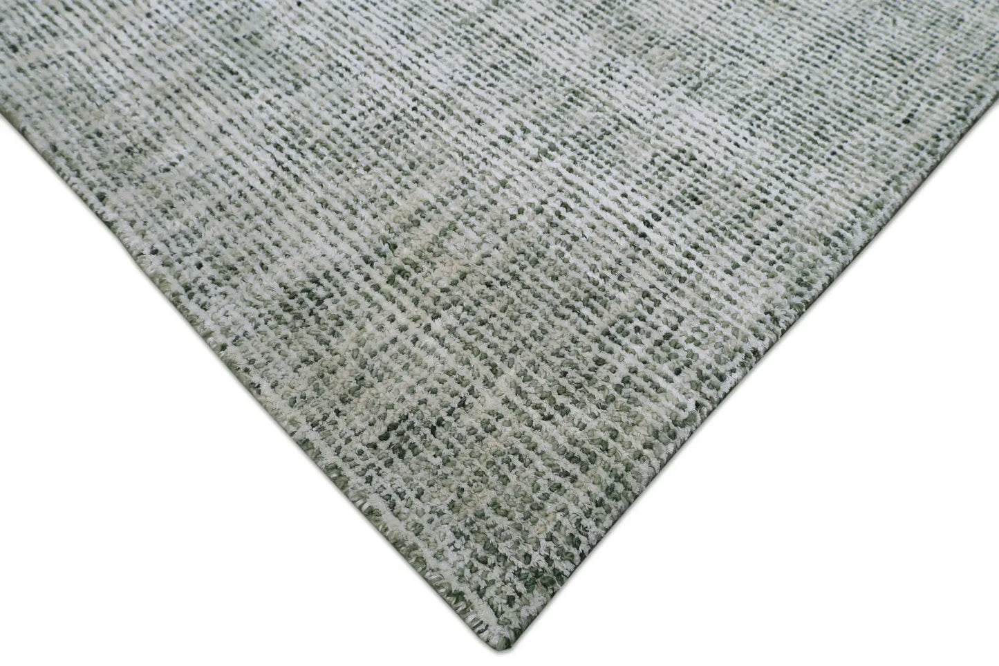Toro Green is a hand-loomed, hand-knotted rug with a contemporary multi-fleck design. Wool and silky viscose are blended to create a soft feel with its 10-12mm pile height. Colour emerald green with white accents. Sizes 160 X 230, 200 X 290, 240 X 340 and 300 X 400. Corner.