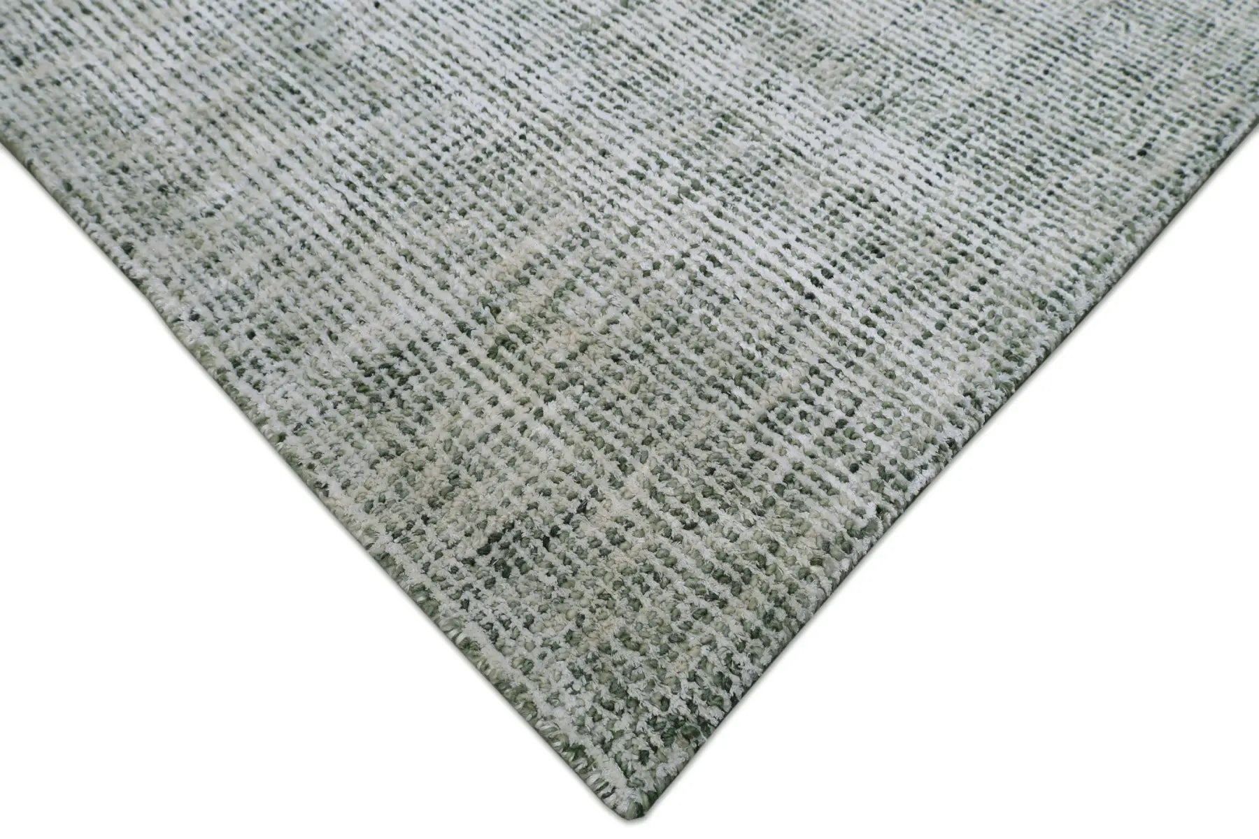 Toro Green is a hand-loomed, hand-knotted rug with a contemporary multi-fleck design. Wool and silky viscose are blended to create a soft feel with its 10-12mm pile height. Colour emerald green with white accents. Sizes 160 X 230, 200 X 290, 240 X 340 and 300 X 400. Corner.