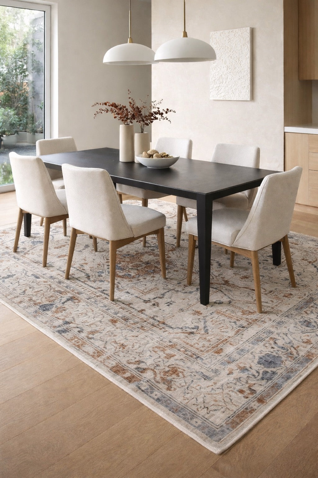 A traditional Machine made rug styled in a modern Perth home dining room setting.