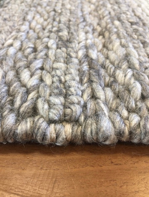 Vaucluse Dark Grey is a textured hand woven loop pile and braided loop wool and viscose rug. It features a contemporary design. Colour Dark Grey with Light Grey accents. Sizes 155 X 225, 200 X 290, 240 X 340 and 300 X 400. Angle.