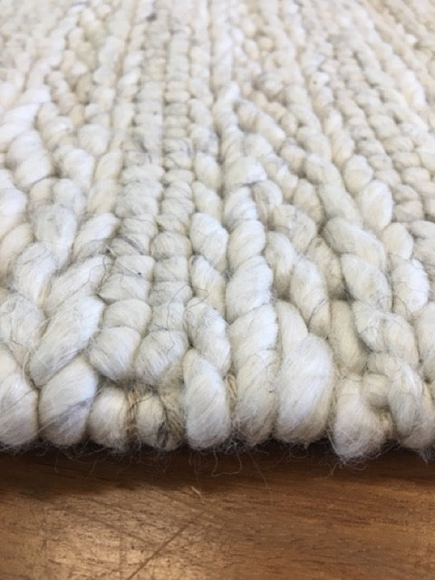 Vaucluse Silver is a textured hand woven loop pile and braided loop wool and viscose rug. It features a contemporary design. Colour Silver. Sizes 155 X 225, 200 X 290, 240 X 340 and 300 X 400. Angle.