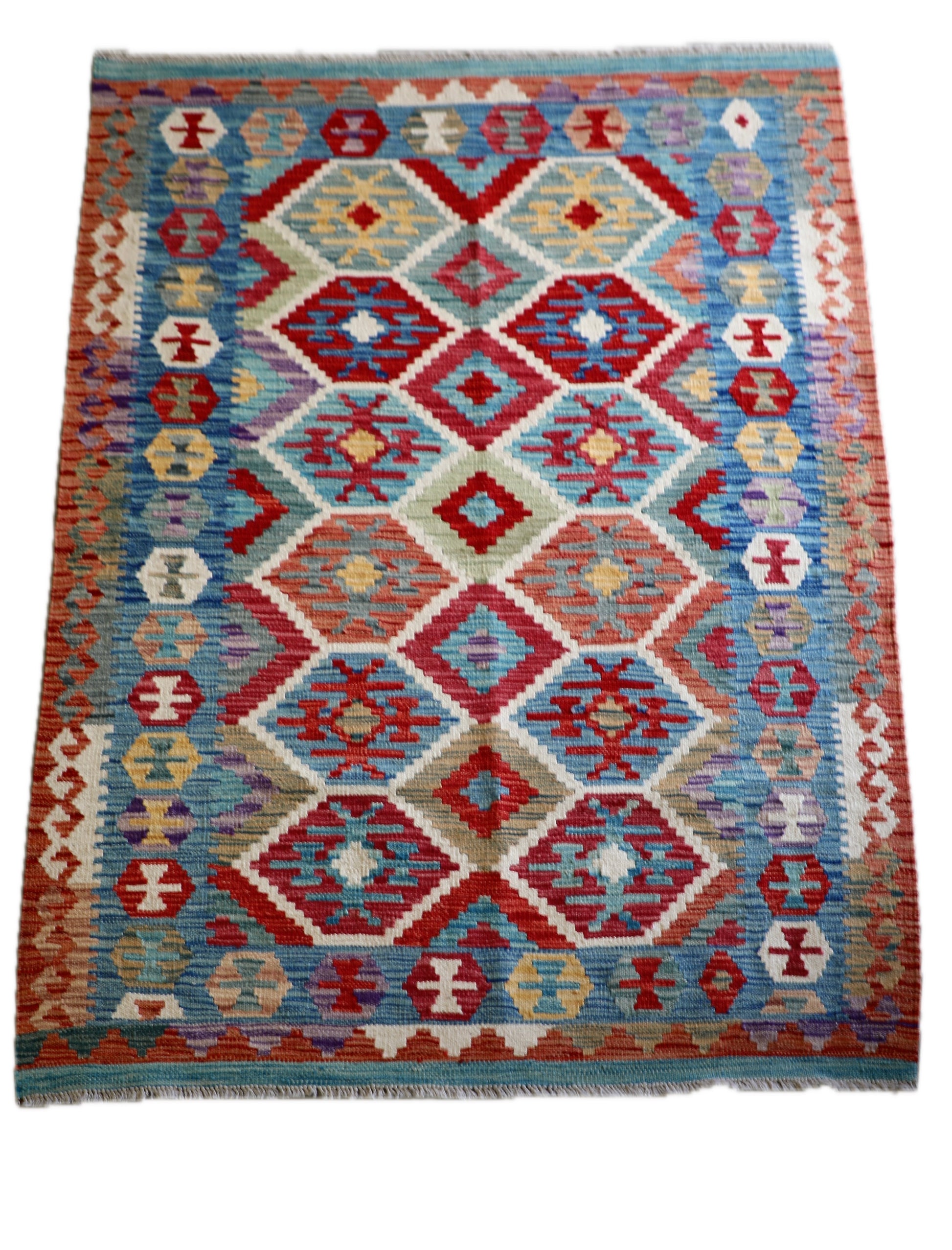 The Afghan Hand Woven Khyber Kilim - 129 X 178.  Crafted using traditional vegetable dyed wool, and featuring traditional geometric designs. Colours, brown, red, blue, cream, teal. Size 129 X 178. Cover.