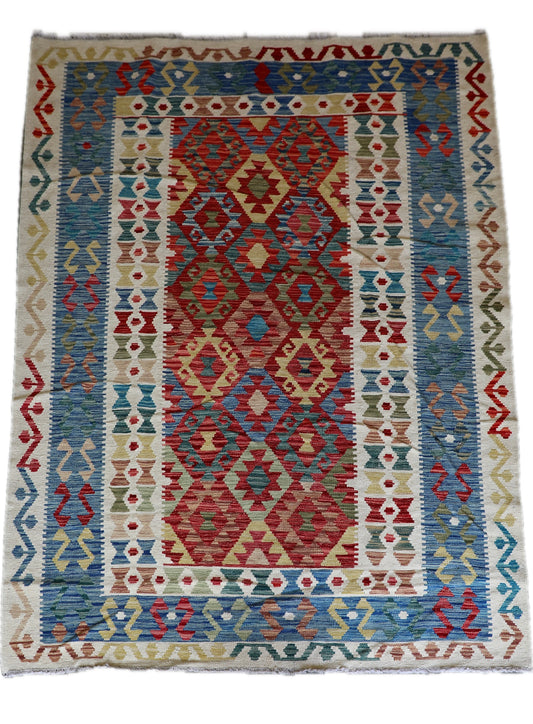The Afghan Hand Woven Khyber Kilim - 180 X 248. Crafted using traditional vegetable dyed wool, and featuring traditional geometric designs. Colours, cream, blues, greens, reds, oranges. Size 180 X 248. Cover.