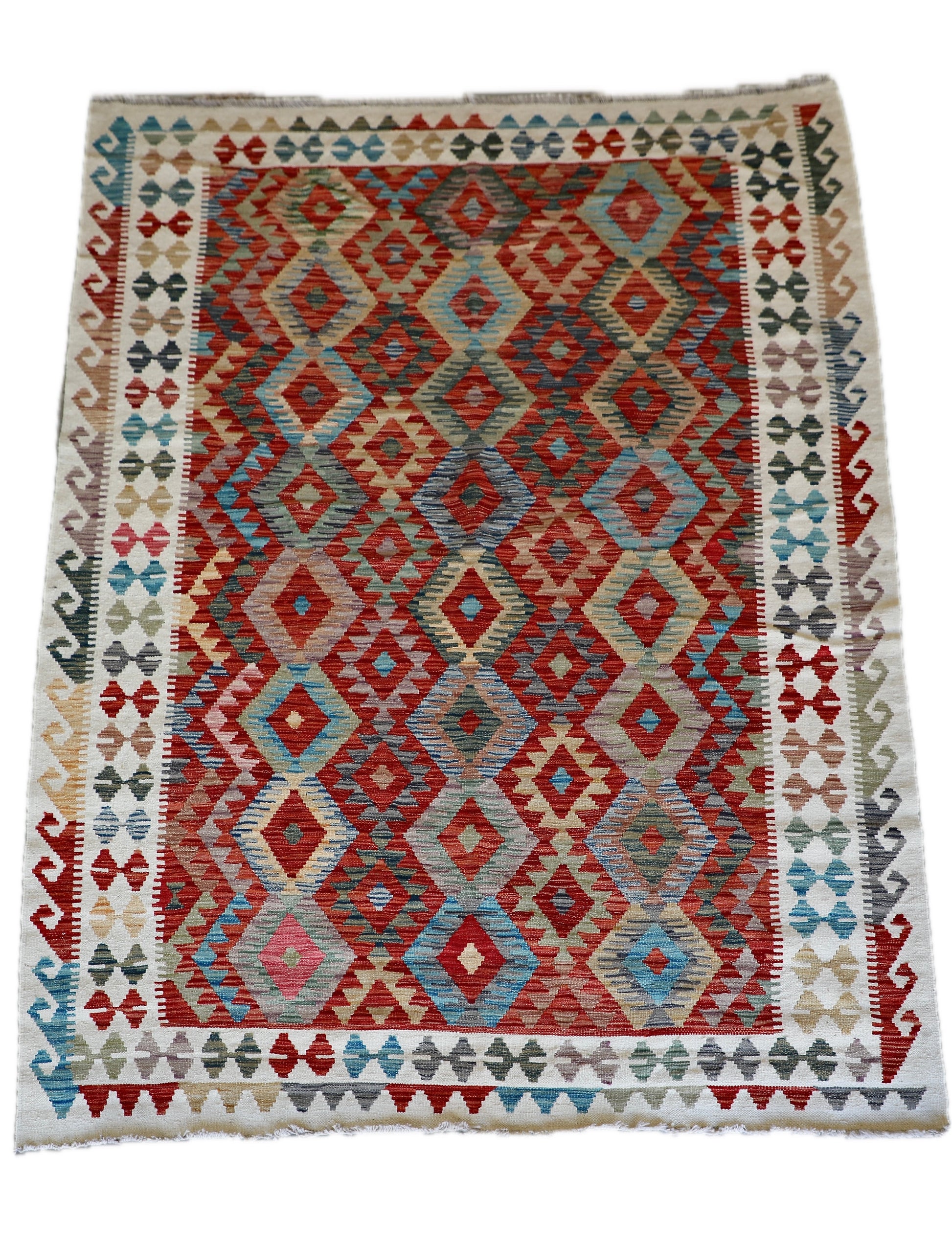 The Afghan Hand Woven Khyber Kilim - 184 X 250. Crafted using traditional vegetable dyed wool, and featuring traditional geometric designs. Colours, cream, reds, oranges, teals, yellows. Size 184 X 250. Cover.