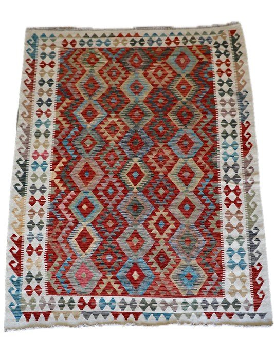 The Afghan Hand Woven Khyber Kilim - 184 X 250. Crafted using traditional vegetable dyed wool, and featuring traditional geometric designs. Colours, cream, reds, oranges, teals, yellows. Size 184 X 250. Cover.