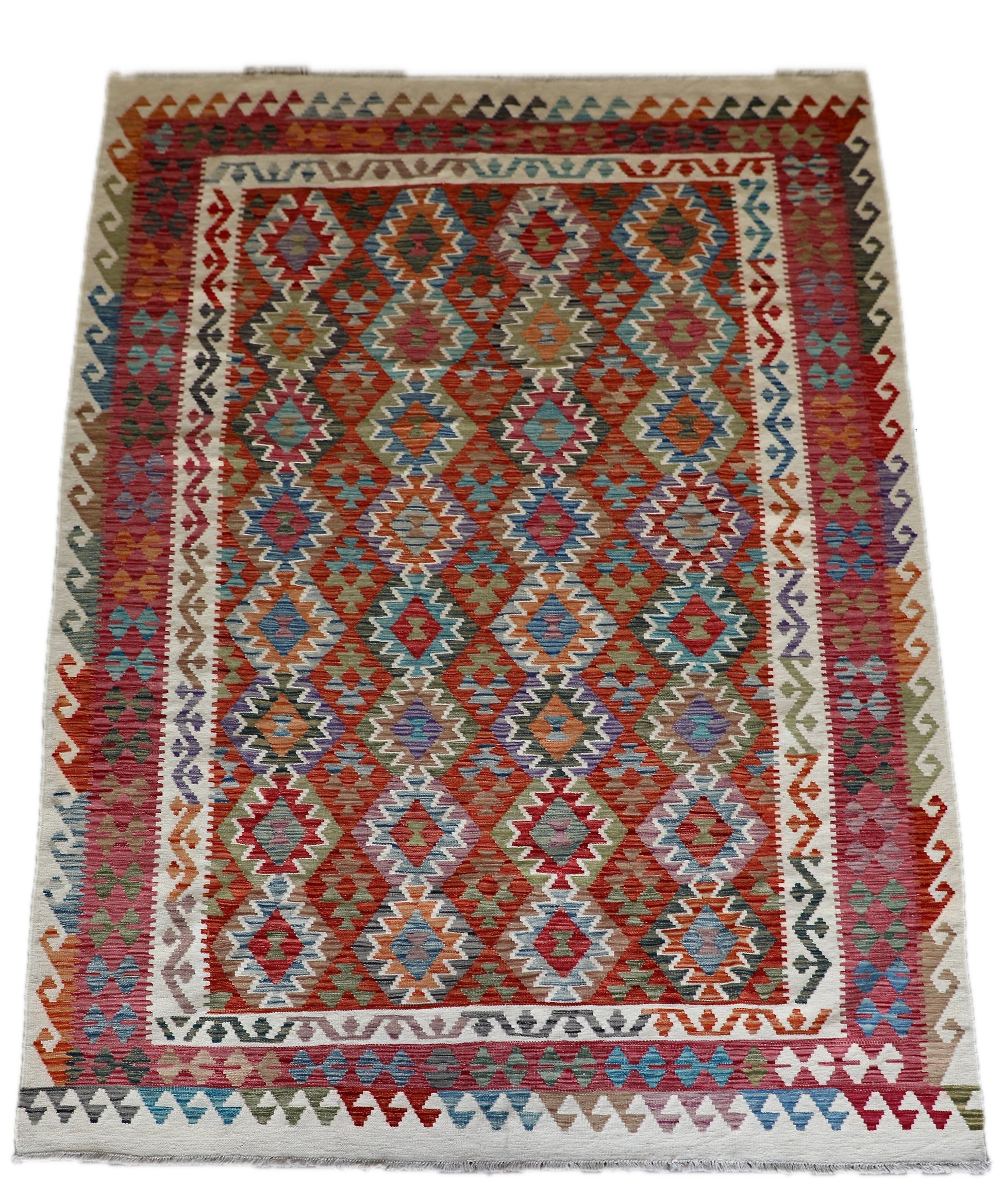 The Afghan Hand Woven Wool Khyber Kilim - 206 X 296.  Crafted using traditional vegetable dyed wool, and featuring traditional geometric designs. Colours, cream, reds, oranges, teals, blues and beiges. Size 206 X 296. Cover.
