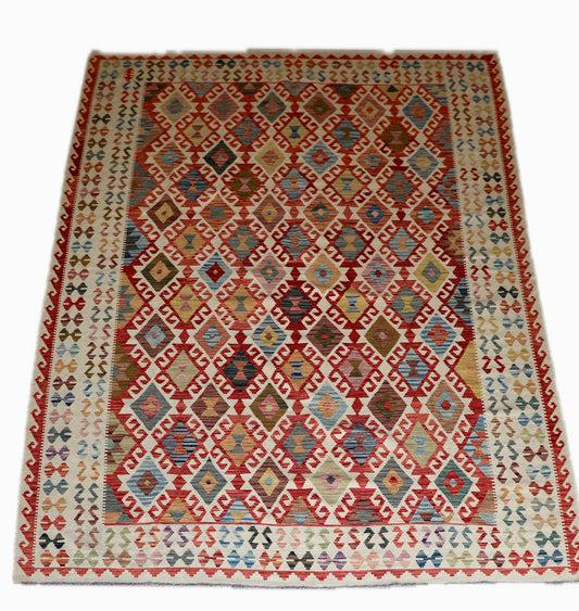 The Afghan Hand Woven Khyber Kilim - 278 X 376. Crafted using traditional vegetable dyed wool, and featuring traditional geometric designs. Colours, cream, blues, reds, oranges, yellow and teals. Size 278 X 376. Cover.