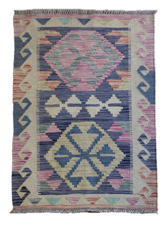 The Afghan Hand Woven Khyber Kilim 63 X 89. Crafted using traditional vegetable dyed wool, and featuring traditional geometric designs. Colours, beiges, light greys, blues. Size 63 X 89. Cover.