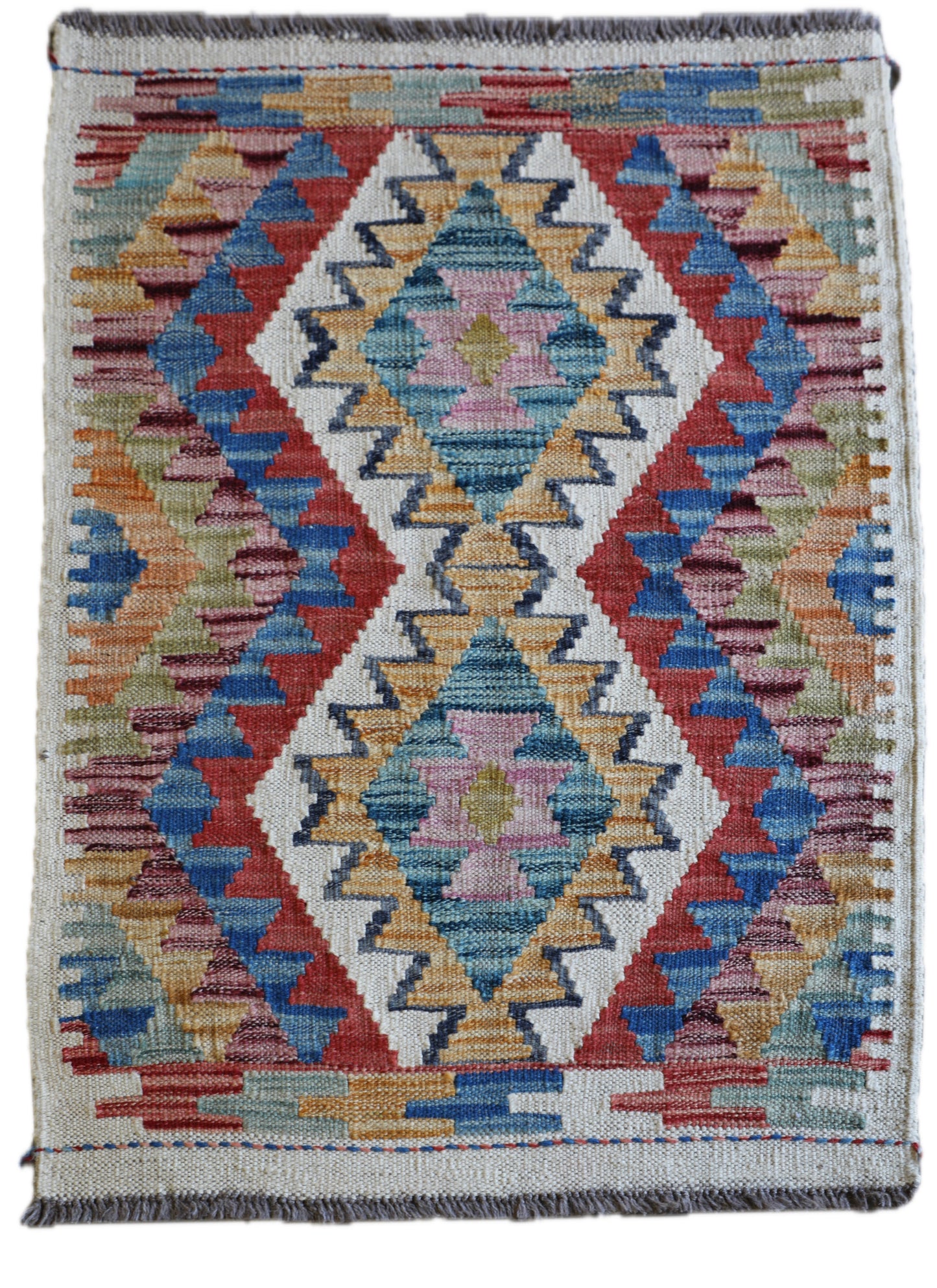 The Afghan Hand Woven Khyber Kilim 66 X 90. Crafted using traditional vegetable dyed wool, and featuring traditional geometric designs. Colours, creams, yellows, oranges, blue and dark greens. Size 66 X 90. Main.