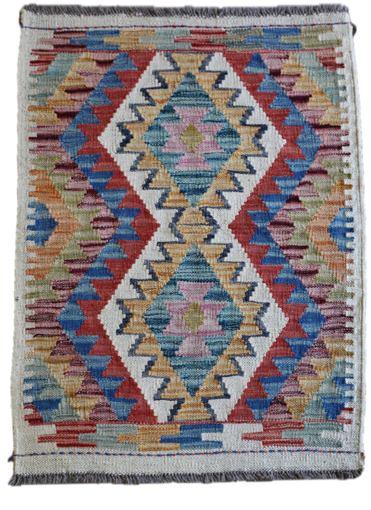The Afghan Hand Woven Khyber Kilim 66 X 90. Crafted using traditional vegetable dyed wool, and featuring traditional geometric designs. Colours, creams, yellows, oranges, blue and dark greens. Size 66 X 90. Main.