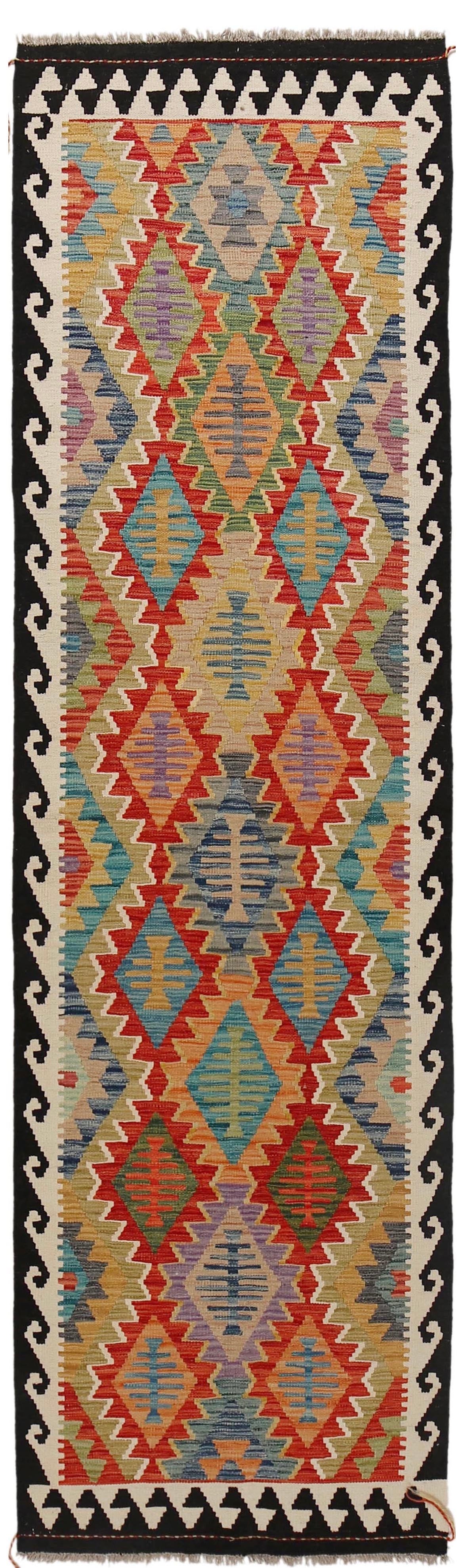 The Afghan Hand Woven Khyber Kilim Runner - 79 X 293.  Crafted using traditional vegetable dyed wool, and featuring traditional geometric designs. Colours, dark blue, creams, beiges, oranges, light greens and more. Measures 79 wide X 293 long. Cover.