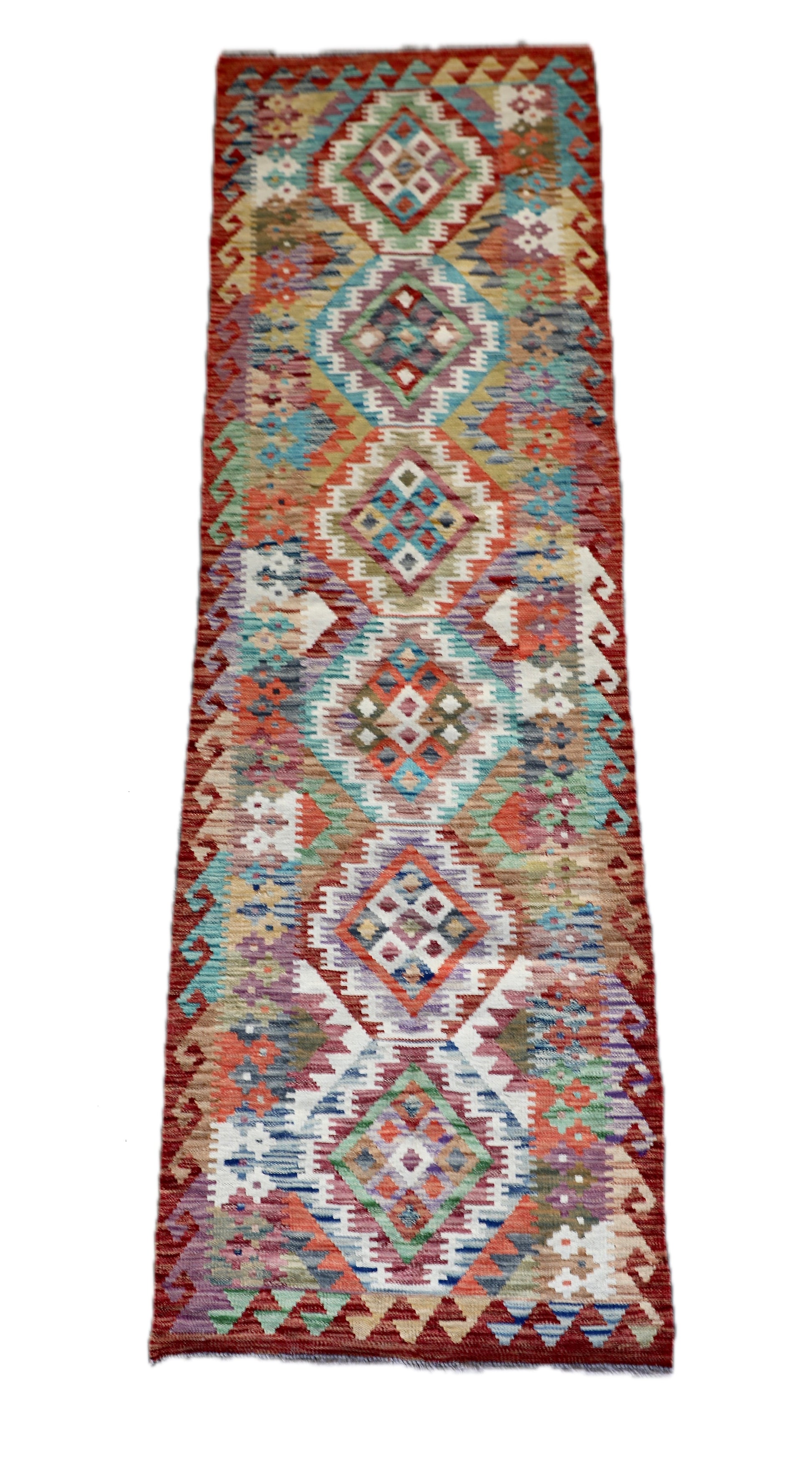 The Afghan Hand Woven Khyber Kilim Runner - 80 X 287. Crafted using traditional vegetable dyed wool, and featuring traditional geometric designs.  Colours, Oranges, reds, yellow, teals and creams. Measures 80 wide X 287 long. Cover.