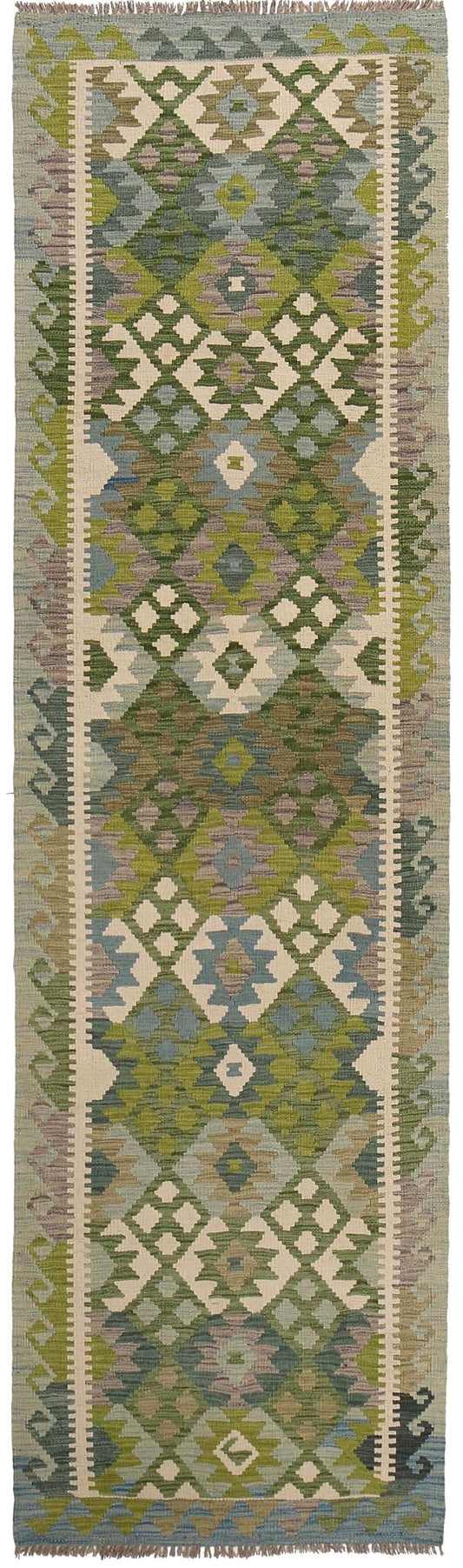 The Afghan Hand Woven Khyber Kilim Runner - 82 X 312.  Crafted using traditional vegetable dyed wool, and featuring traditional geometric designs. Colours, greens, creams, beiges, oranges, blues. Measures 82 wide X 312 long. Cover.