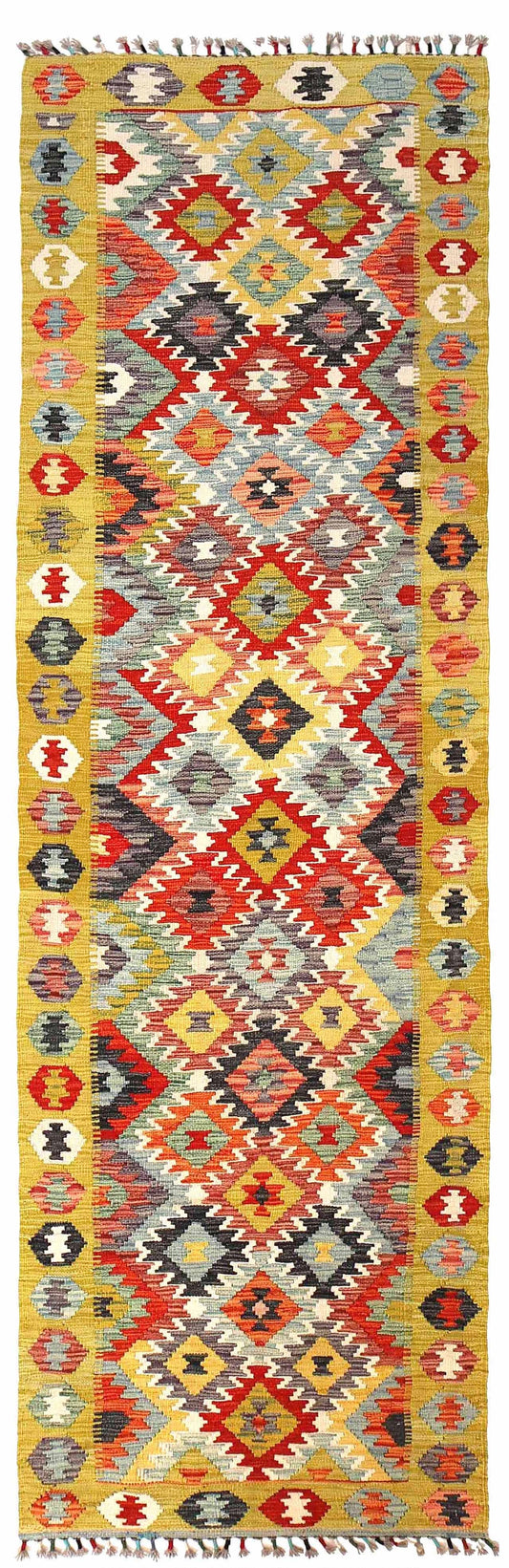 The Afghan Hand Woven Khyber Kilim Runner - 86 X 290.  Crafted using traditional vegetable dyed wool, and featuring traditional geometric designs. Colours, yellows, creams, beiges, oranges, blues and more. Measures 86 wide X 290 long. Cover.