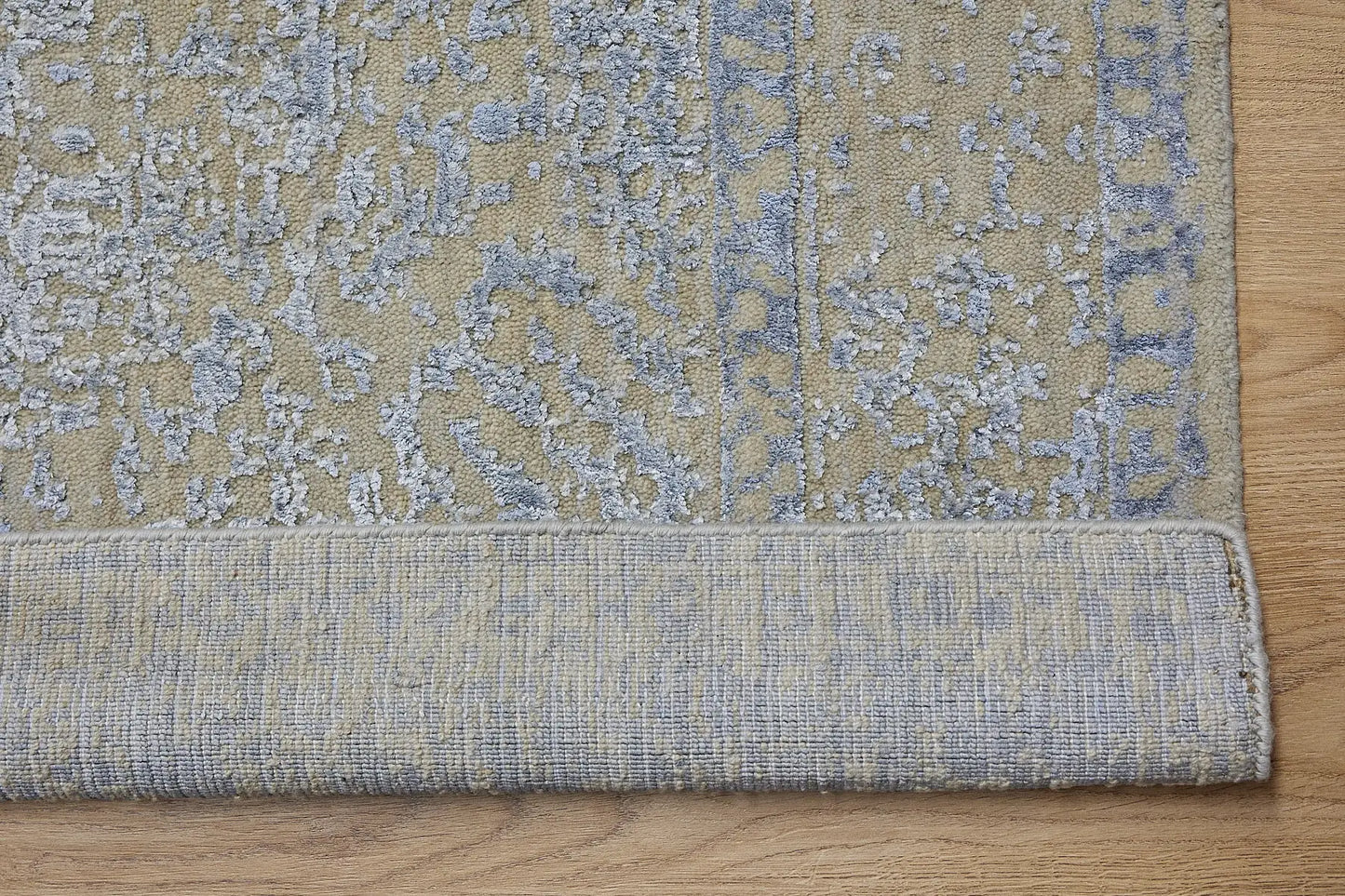 Victoria Silver is hand-loomed rug from silky viscose. Featuring a vintage distressed traditional design and medium texture. Has a pile height of 10-12mm. Colour Silver with light blue accents. Sizes 160 X 230, 200 X 290 and 240 X 340. Fold.
