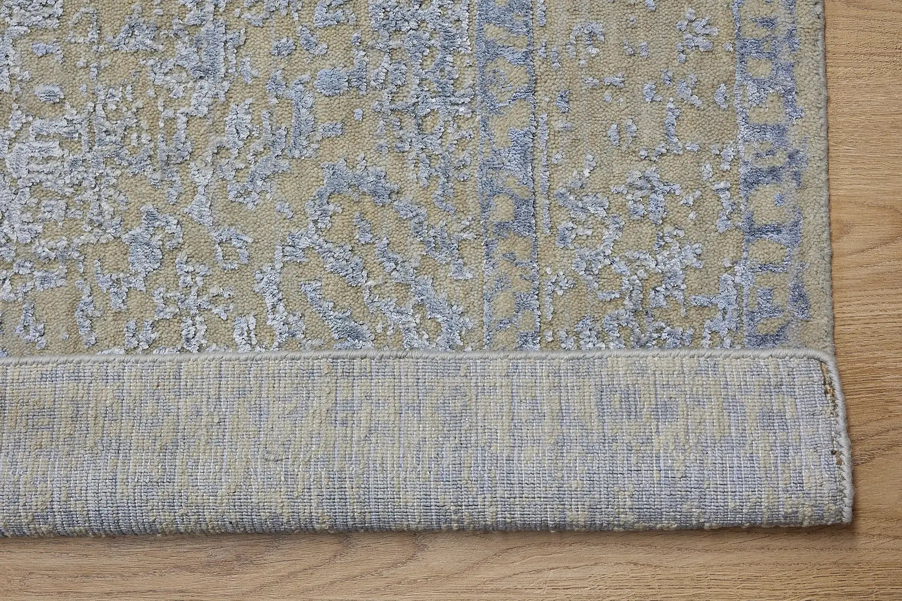 Victoria Silver is hand-loomed rug from silky viscose. Featuring a vintage distressed traditional design and medium texture. Has a pile height of 10-12mm. Colour Silver with light blue accents. Sizes 160 X 230, 200 X 290 and 240 X 340. Fold.