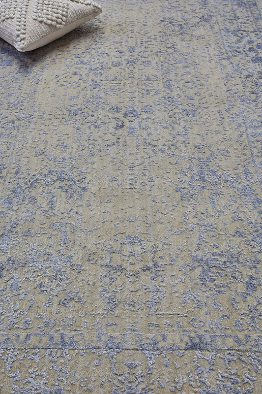 Victoria Silver is hand-loomed rug from silky viscose. Featuring a vintage distressed traditional design and medium texture. Has a pile height of 10-12mm. Colour Silver with light blue accents. Sizes 160 X 230, 200 X 290 and 240 X 340. Life.