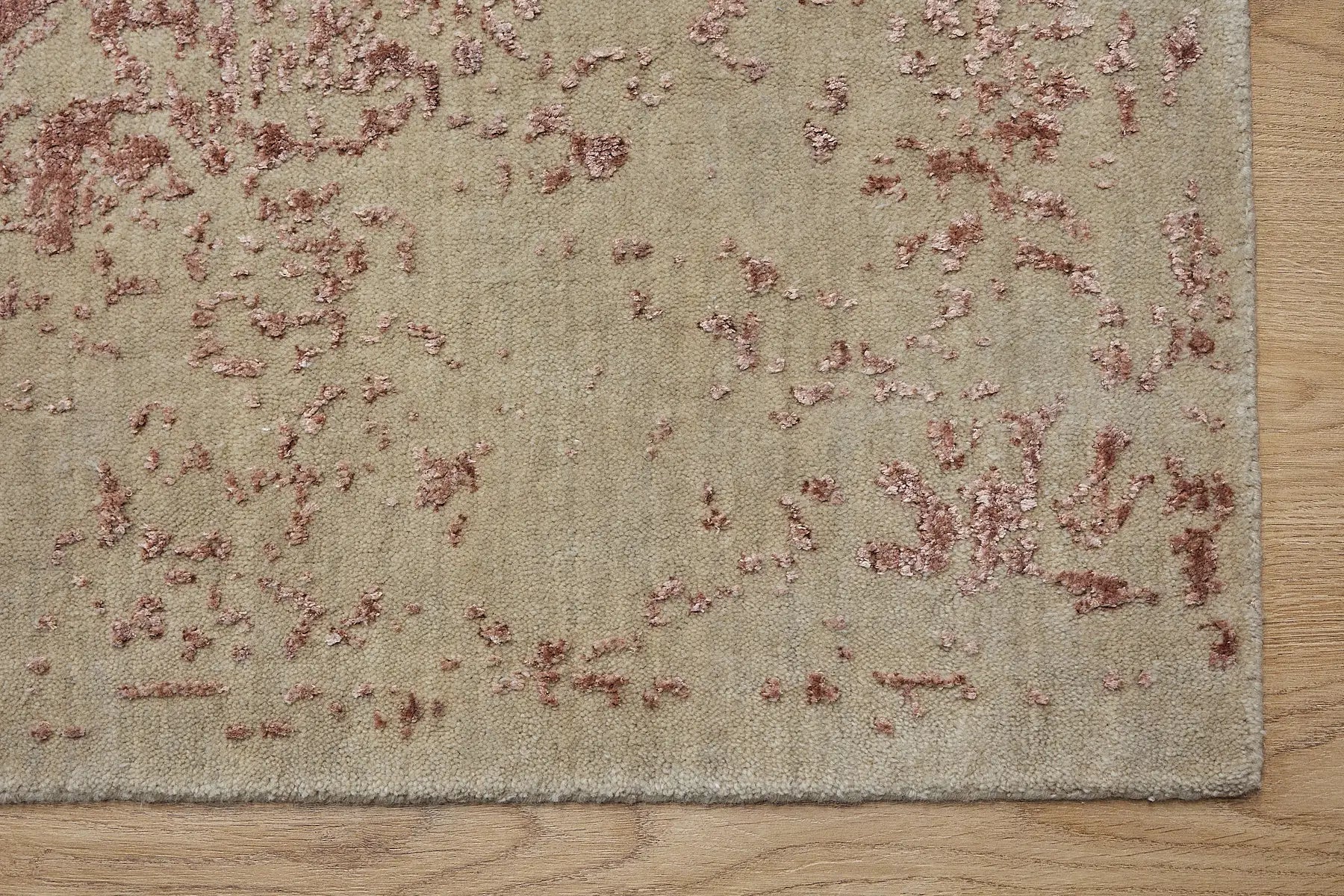 Victoria Terra is hand-loomed rug from silky viscose. Featuring a vintage distressed traditional design and medium texture. Has a pile height of 10-12mm. Colour Beige with Red Terracotta accents. Sizes 160 X 230, 200 X 290 and 240 X 340. Corner.