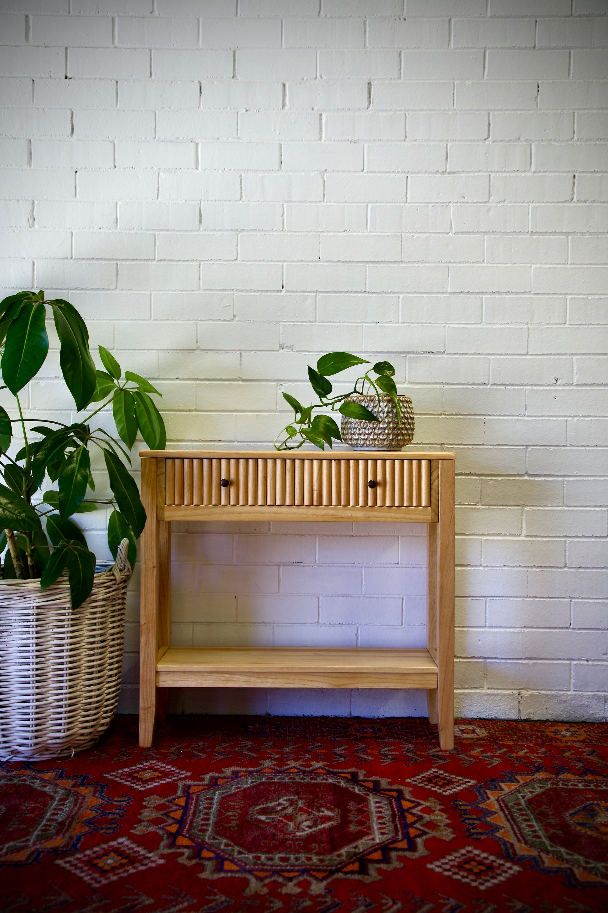 The Vienna - 1 Drawer Natural Console, natural, brings a contemporary feel with its sleek design and textured drawer face. Built with sustainable white cedar its 1-drawer sits on wooden runners. Colour natural. Measures 800 length X 250 depth X 750 height. Front Styled.