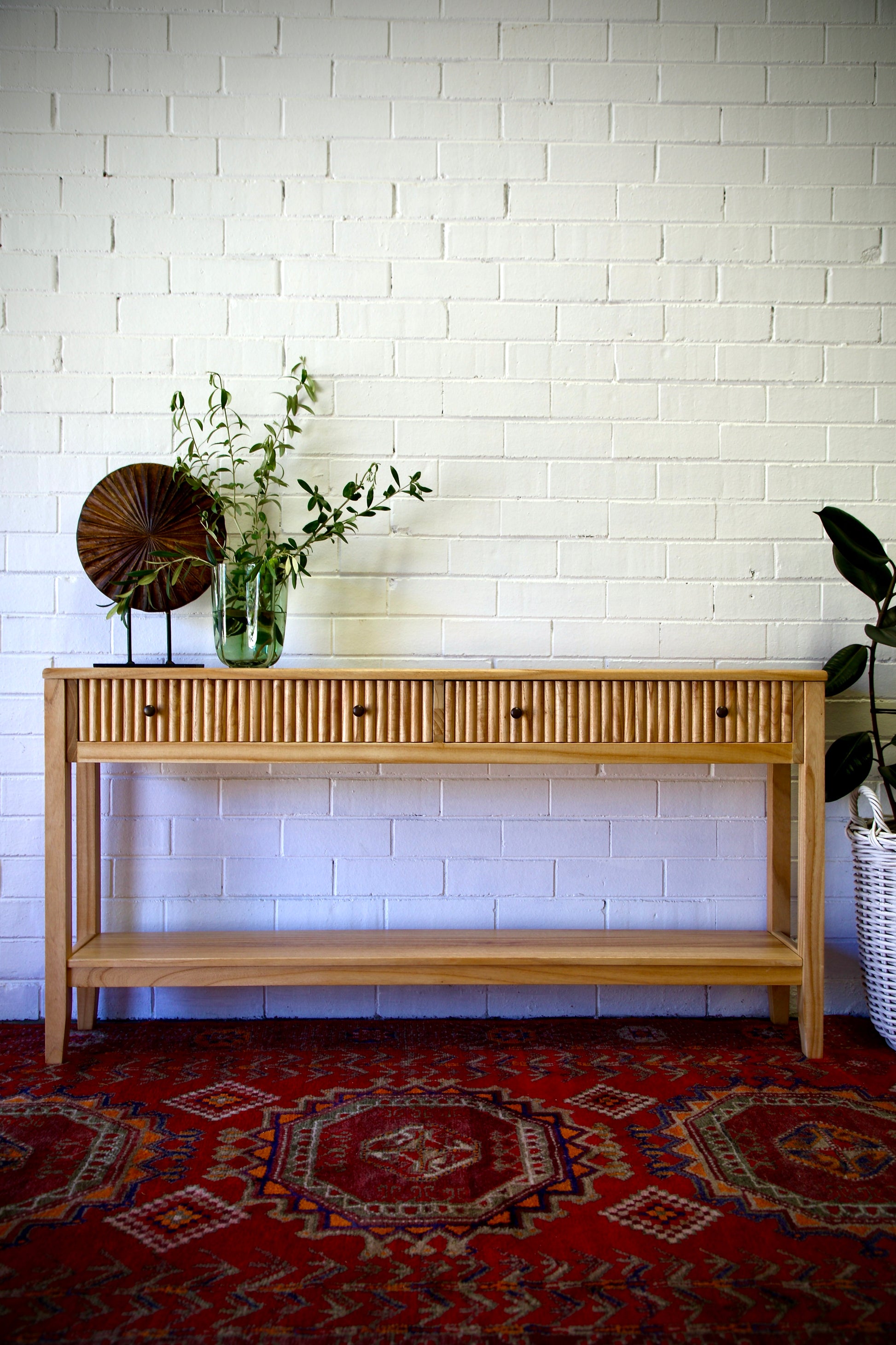 The Vienna - 2 Drawer Natural 1800 Console, natural, brings a contemporary feel with its sleek design and textured drawer face. Built with sustainable white cedar its 2 drawers sit on wooden runners. Colour natural. Measures 1800 length X 250 depth X 750 height. Styled.