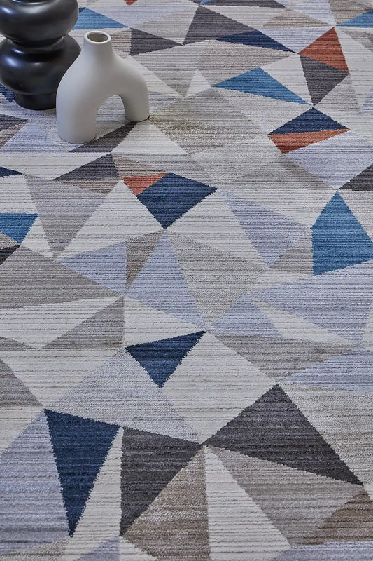 Vienna Triangle is a polyester machine made geometric modern/contemporary rug.  It features a 7-9mm Pile height for a soft luxurious feel.  Colours white, silver, with blue and orange beige accents. Sizes 160 X 230, 200 X 290, 240 X 340 and 300 X 400. Life.