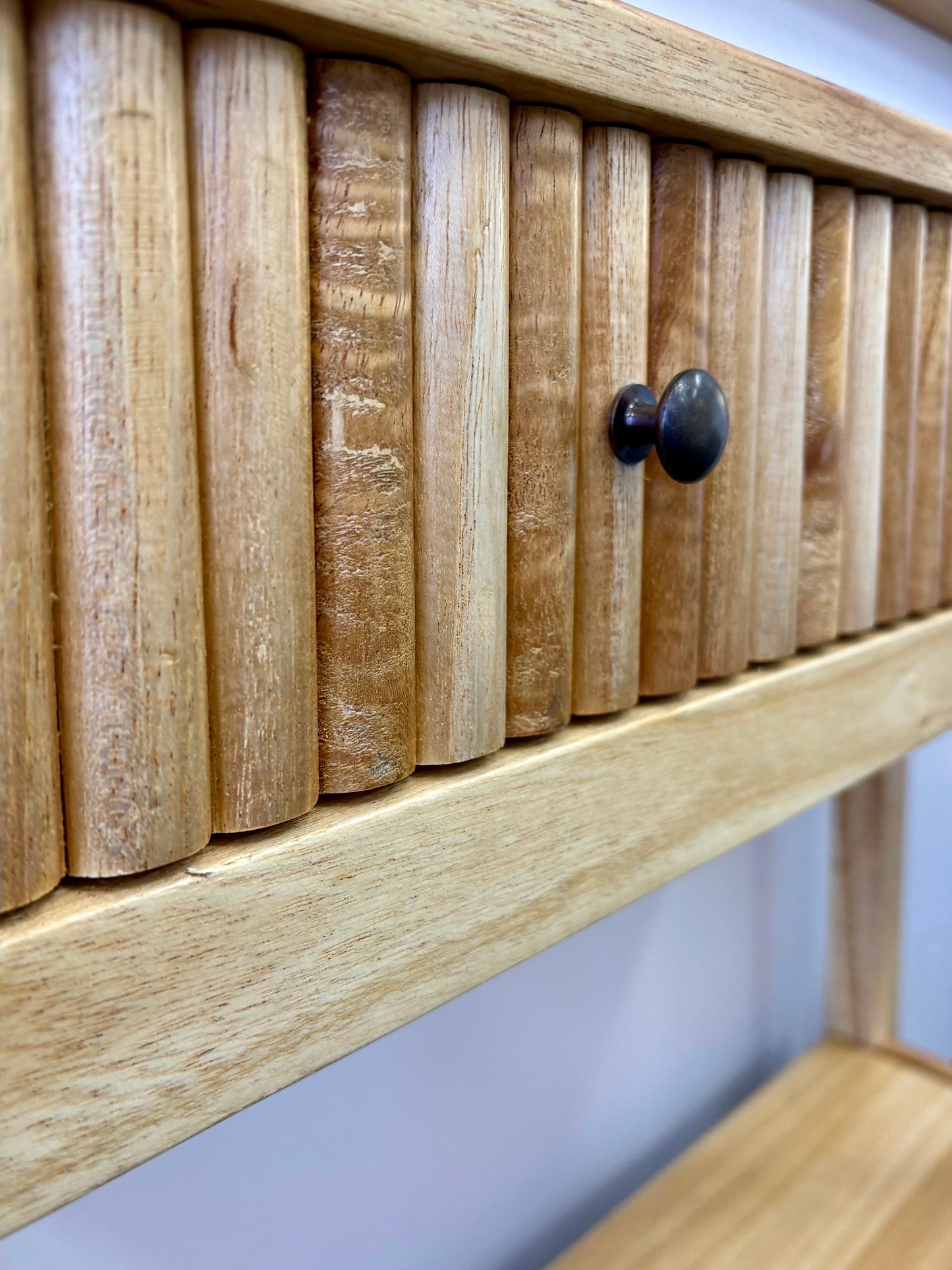 The Vienna - 1 Drawer Natural Console, natural, brings a contemporary feel with its sleek design and textured drawer face. Built with sustainable white cedar its 1-drawer sits on wooden runners. Colour natural. Measures 800 length X 250 depth X 750 height. Close.